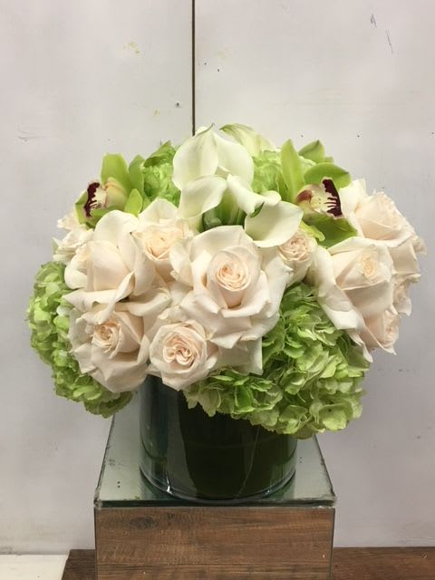 Coming Home - A gorgeous arrangement with white roses and cymbidium orchids. 