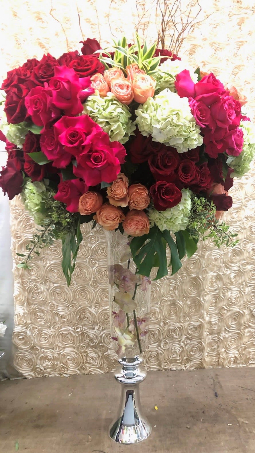 Dreamscape - A gorgeous and grand tall arrangement filled with colorful roses and other flowers of the season,. 