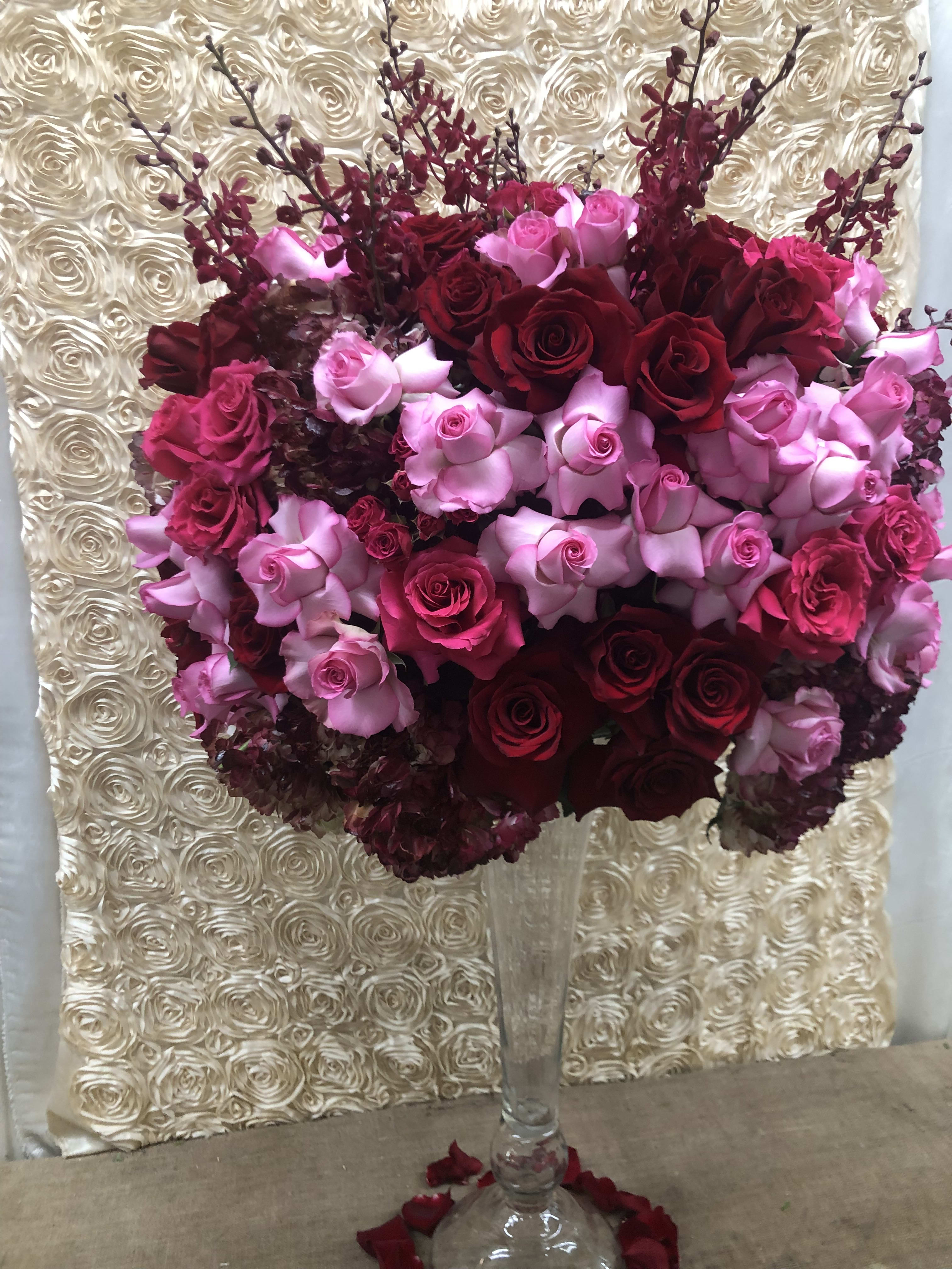 Endless Love Endless Love - This glorious and grand arrangement is filled with stunning red, and pink roses and will absolutely put the biggest smile on YOUR Endless Love!