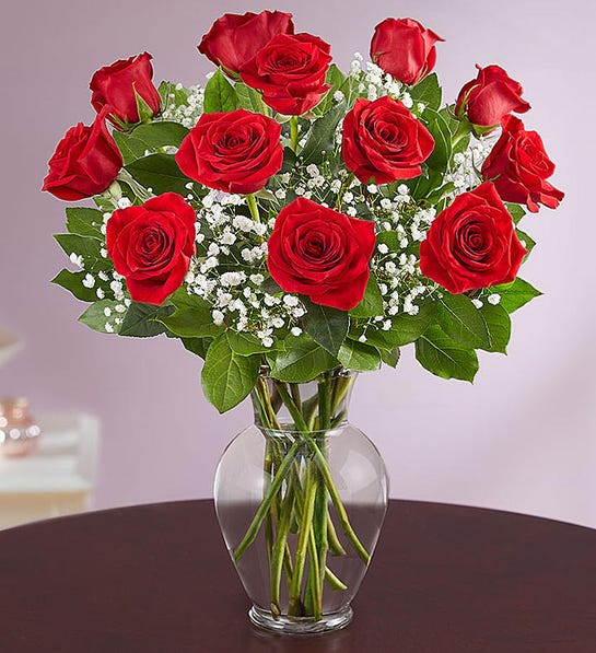 Dozen Roses with Filler - A dozen premium red roses arranged in a glass vase with filler and greenery. Vase and filler may vary. Upgraded pricing includes additional roses. Put alternate color preference in special instructions,  we can not guarantee for same day for special color. 