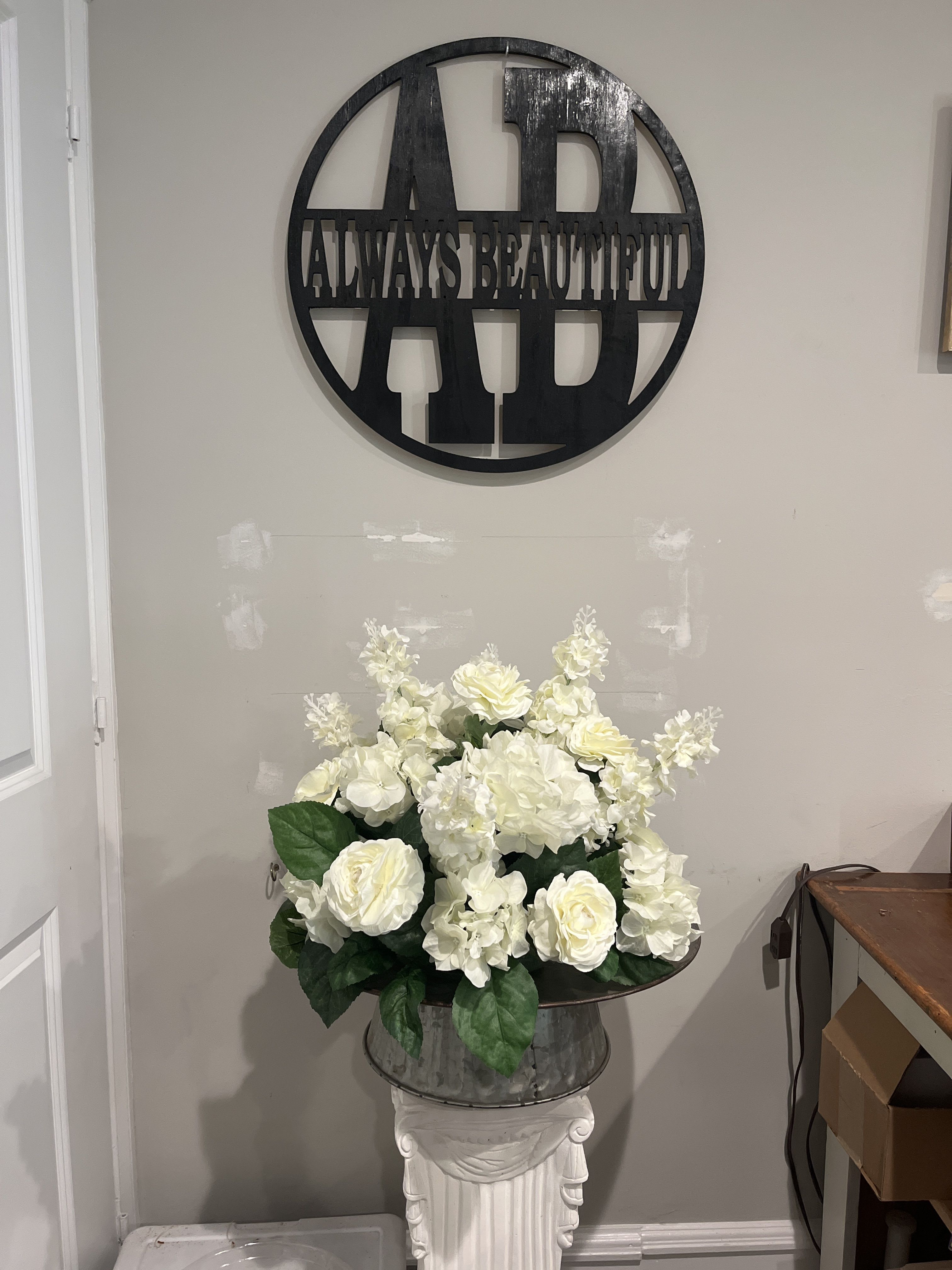 White Round Centerpiece Rentals - Elevate your event with the pure sophistication of our all-white centerpiece. Thoughtfully designed with an exquisite blend of pristine white roses, Ranunculus, Hydrangea and delphinium, this arrangement brings a touch of timeless elegance to any table setting. Perfect for weddings, anniversaries, or any occasion that calls for a classic, refined look, our all-white centerpiece adds a serene and luxurious ambiance that captivates and enchants.  Let your guests be wowed by the understated beauty of pure white blooms, expertly arranged to create a stunning focal point.  This package includes (5) Centerpieces for the Standard Pricing, (7) Centerpieces for the Deluxe Pricing and (10) Centerpieces for the Premium Pricing. A Refundable deposit is included in the price upon Return of Centerpieces, or we can pick them up for you for an Additional Charge.