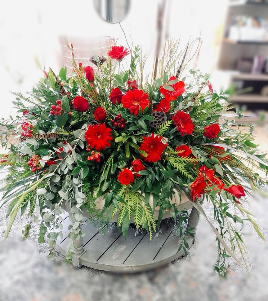 Devoted Love Casket Cover - An all red tribute, this casket spray is straight from the heart. Featuring a variety of red flowers and greenery, this full casket spray compliments the beauty of life.