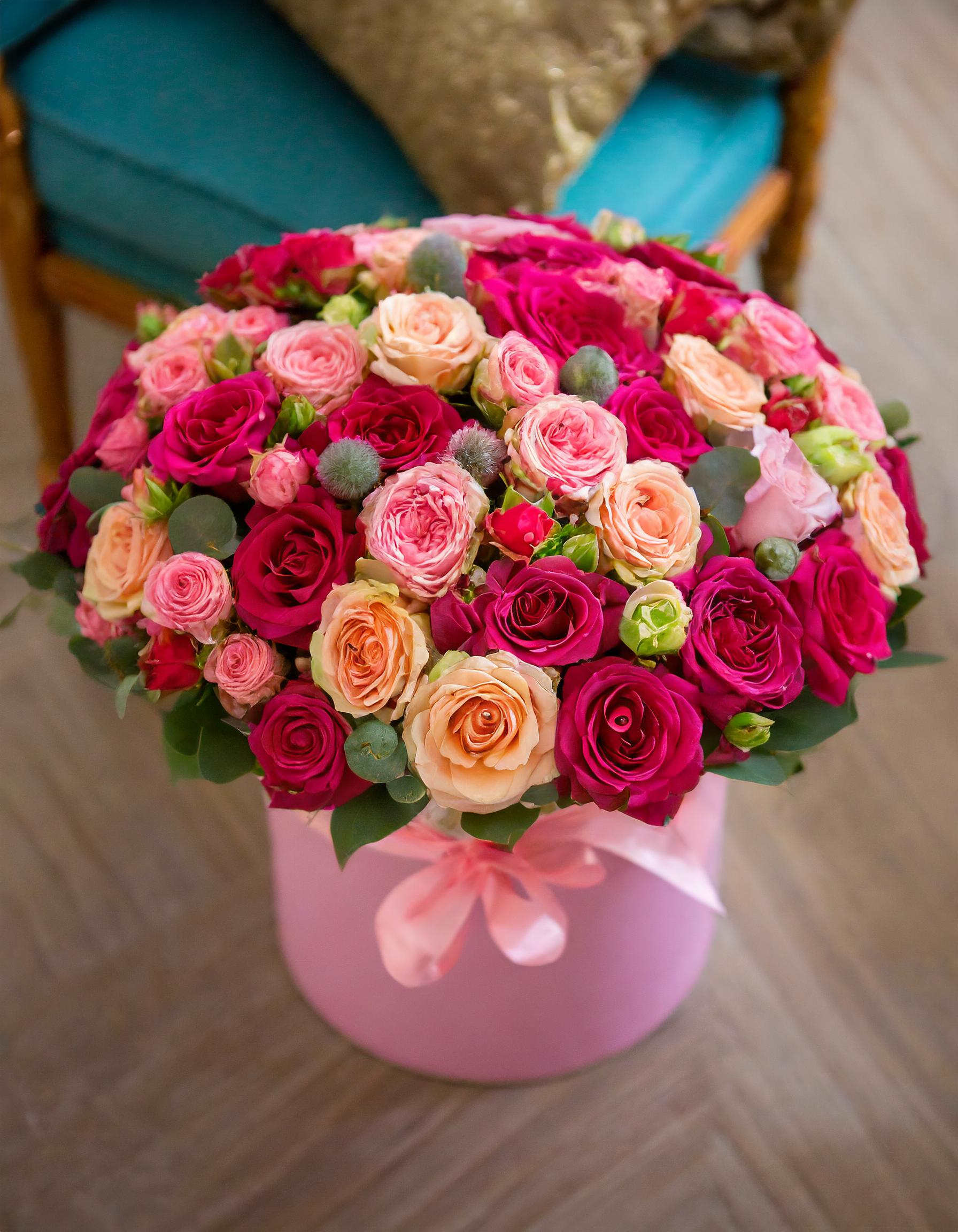 Chic Petal Parade - A luxurious arrangement indeed! Mixing bright colors like hot pink and peach roses with other vibrant flowers can create a stunning visual impact. The perfect gift for someone who appreciates beauty and luxury!  Disclaimer: IMAGES PROVIDED ARE ALL IN DELUXE SIZE. Photos and visual presentation of the products represent an overall style, look and feel, which we may not be able to identically replicate in some instances.