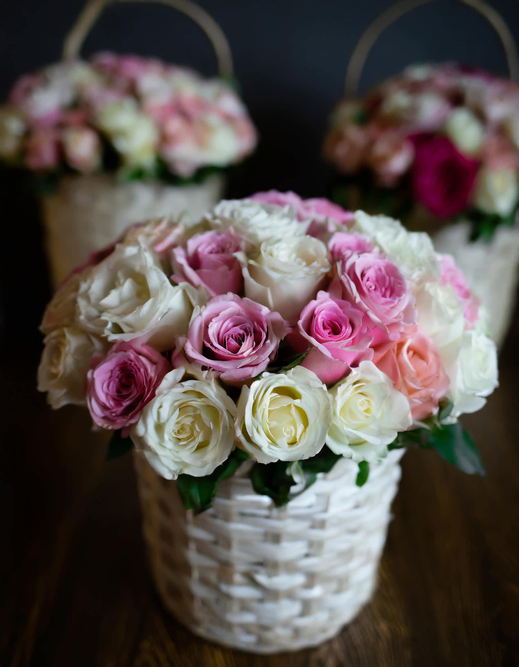 White and Pink Blooms  - Pink and white roses, elegantly arranged in a basket. Our stunning flowers, sourced from top growers, promise to add beauty to any occasion.  Disclaimer: IMAGE PROVIDED ARE IN DELUXE SIZE  Photos and visual presentation of the products represent an overall style, look and feel, which we may not be able to identically replicate in some instances.&quot;