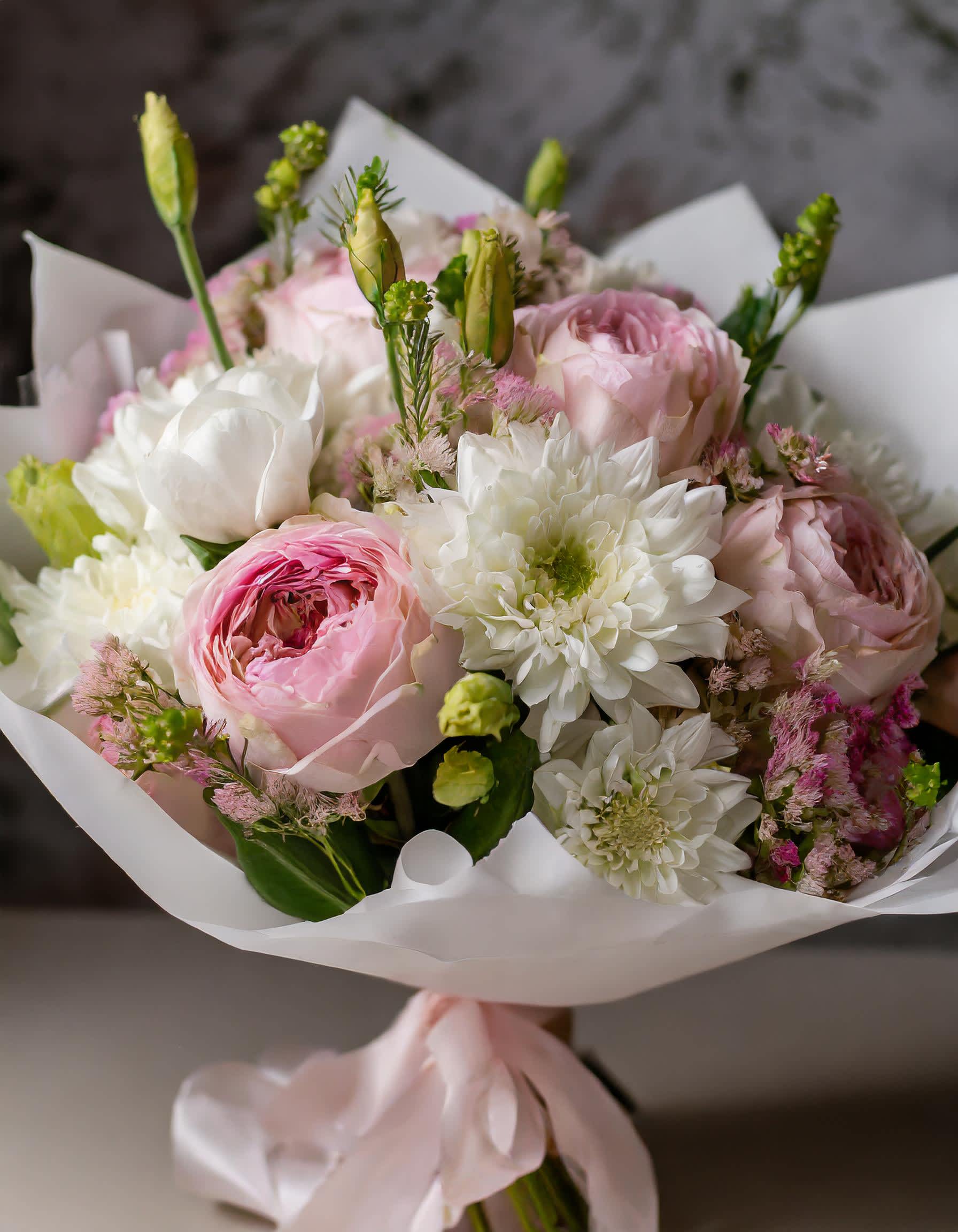 Kiss of Love - Dive into a world of pure bliss with our stunning pure white pink blooms. Each bouquet is a masterpiece that speaks volumes of joy and love. Let happiness blossom!   Disclaimer: ALL IMAGES PROVIDED AT STANDARD PRICE Photos and visual presentation of the products represent an overall style, look and feel, which we may not be able to identically replicate in some instances.