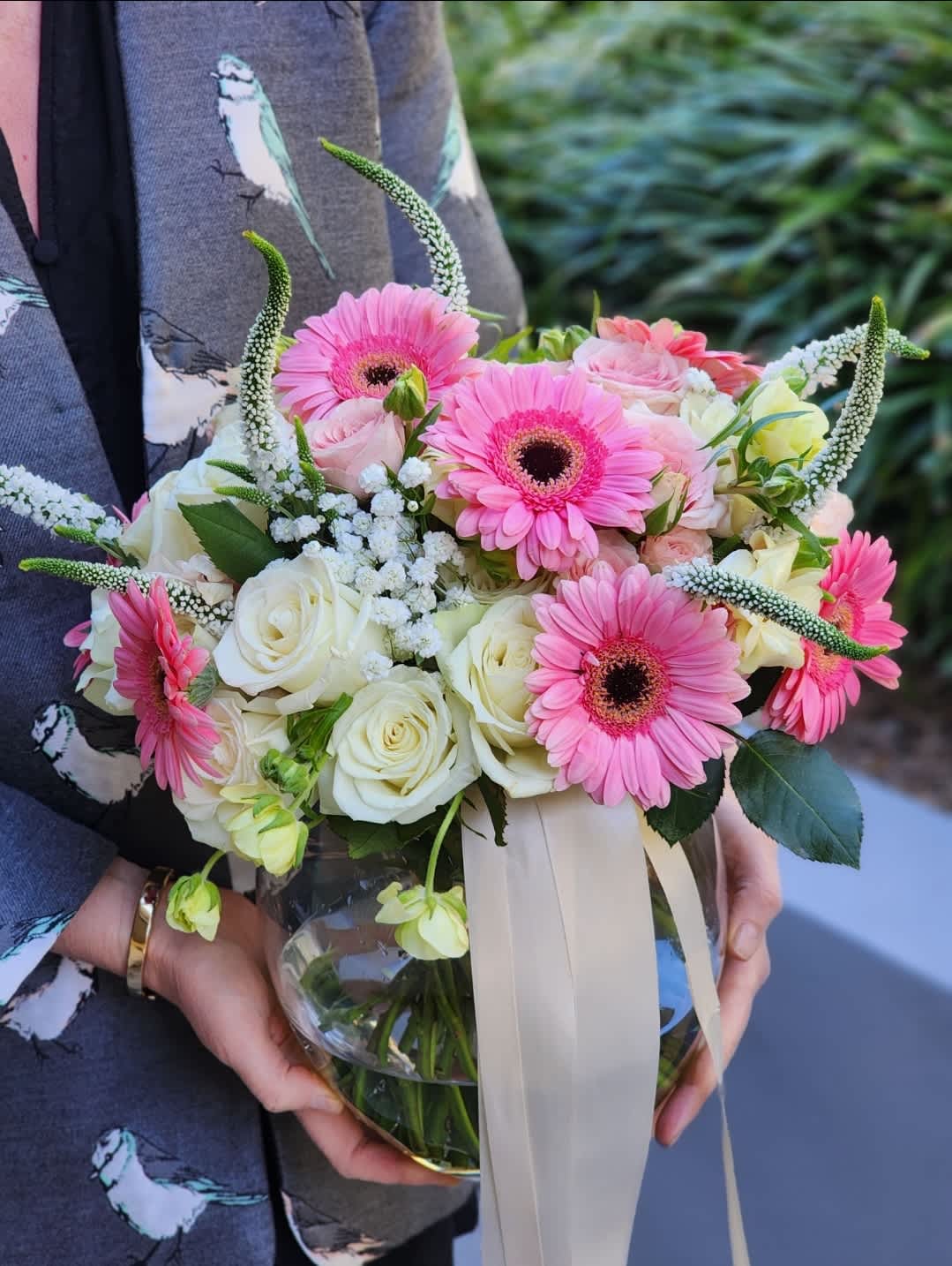 Sun-kissed Spring - A charming and beautiful bouquet in a clear vase, featuring a delightful mix of pink and white flowers. This lovely arrangement includes an assortment of  blossoms, creating a delightful blend of colors and blooms.  ALL IMAGES PROVIDED AT DELUXE PRICE