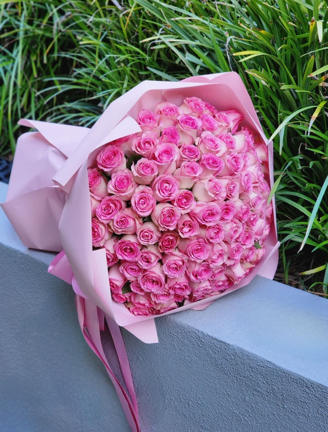 Pink Roses Bouquet - Pink roses are recognized queens of the flower world. Passionate and sensual, they will be a wonderful gift for any celebration. Packed in fancy paper with ribbon. It looks elegant!  Disclaimer: ALL IMAGES PROVIDED AT 100 ROSES  Recommended for: Love and Romance, I Love You Flowers, Anniversary, Proposal,  Romantic Gift, Birthday, Get Well Soon, Celebrations, Best Wishes, Thank You, Congratulations, Just Because, New Baby, Everyday, Mother's Day 
