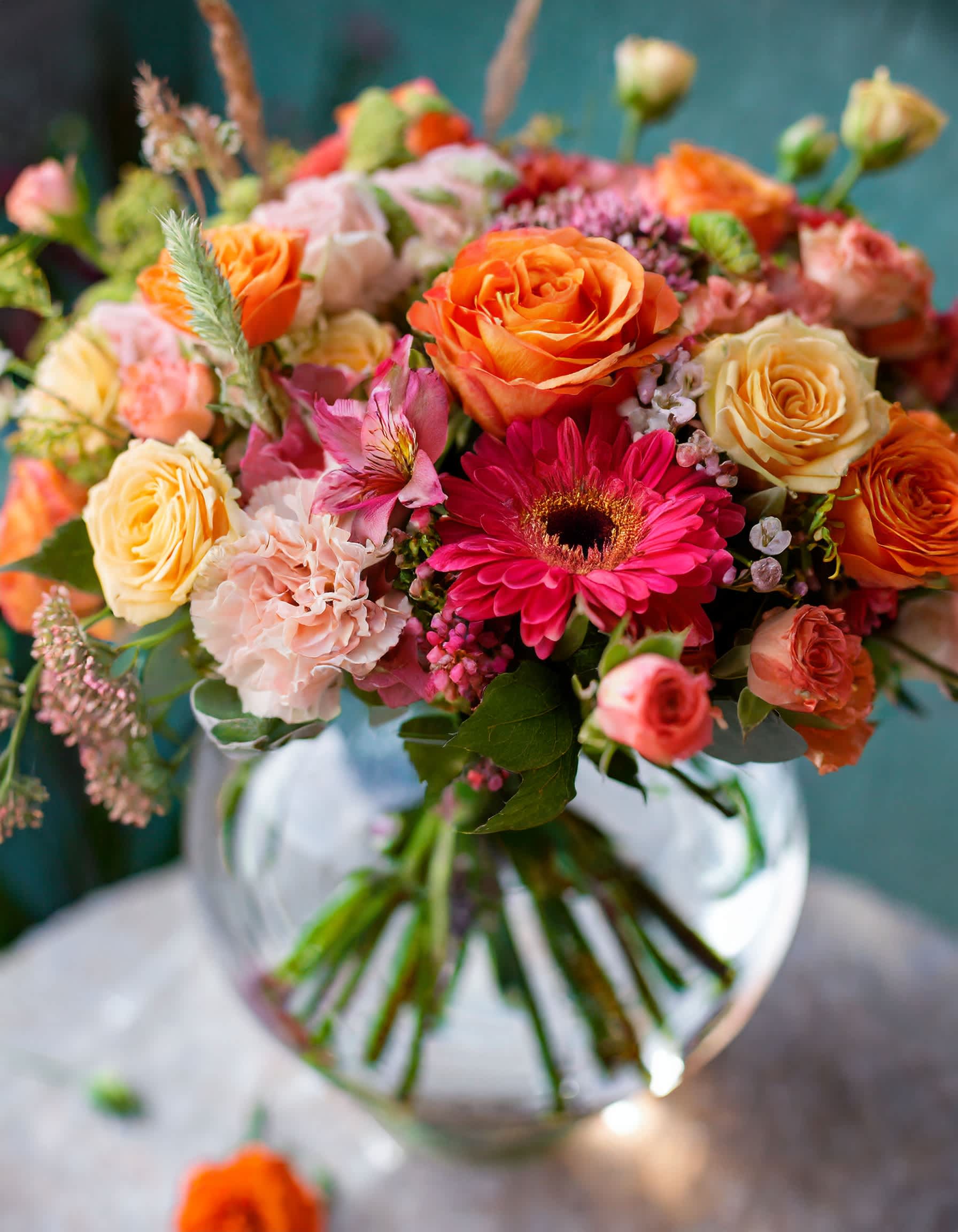 The Untamed - Flowers in a peach, orange, hot pink palette come together to create a gentle and sophisticated composition, evolving into a classic display.  Disclaimer: ALL IMAGES PROVIDED AT DELUXE PRICE Photos and visual presentation of the products represent an overall style, look and feel, which we may not be able to identically replicate in some instances.  Recommended for: Love and Romance, I Love You Flowers, Anniversary, Proposal,  Romantic Gift, Birthday, Get Well Soon, Celebrations, Best Wishes, Thank You, Congratulations, Just Because, New Baby, Everyday