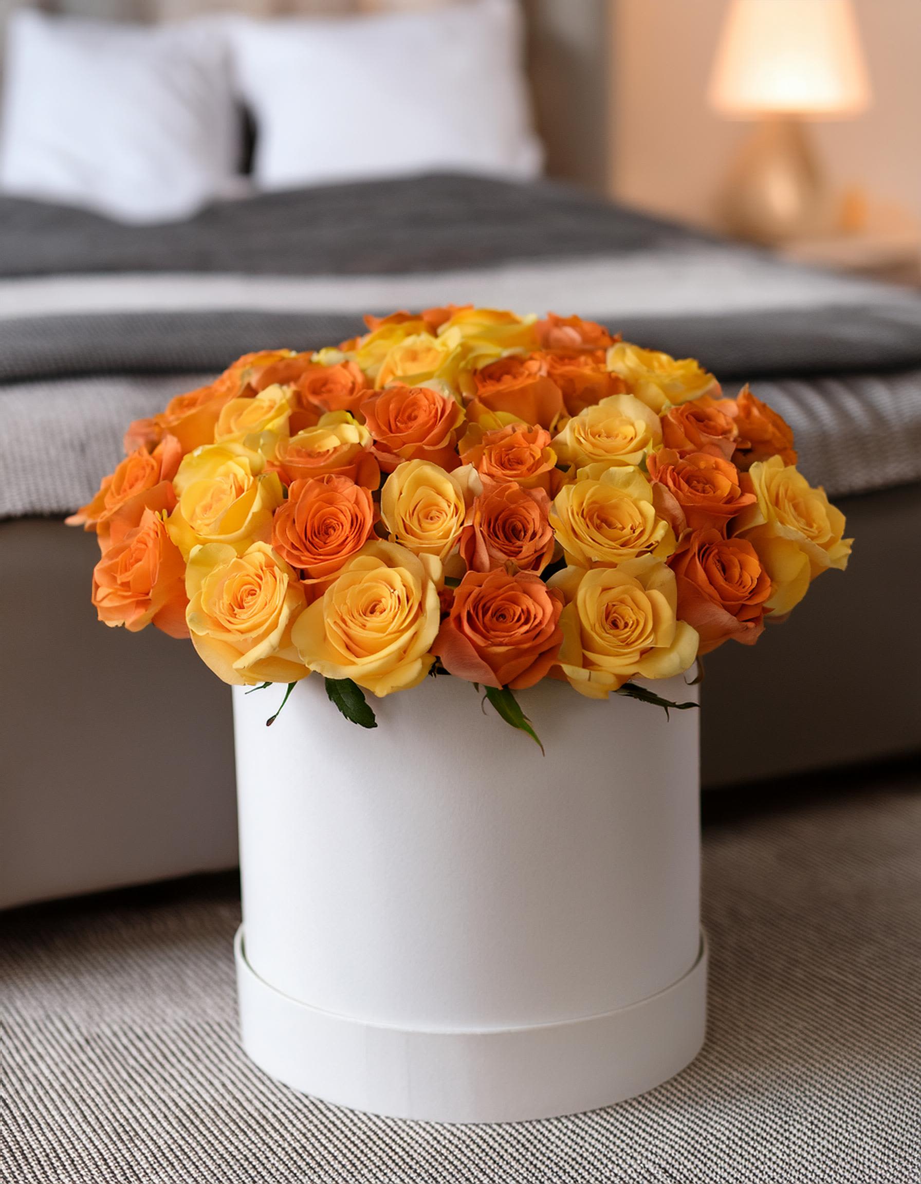 Rose Radiance Rose Radiance - Enjoy your moments with our luxurious hatbox arrangement, featuring vibrant yellow and orange roses that captivate with their brilliance. Perfect for any celebration, this exquisite floral gift adds a touch of elegance and makes your expression of love unforgettable. Whether it's for a birthday, anniversary, or just because, this premium arrangement is sure to leave a lasting impression.