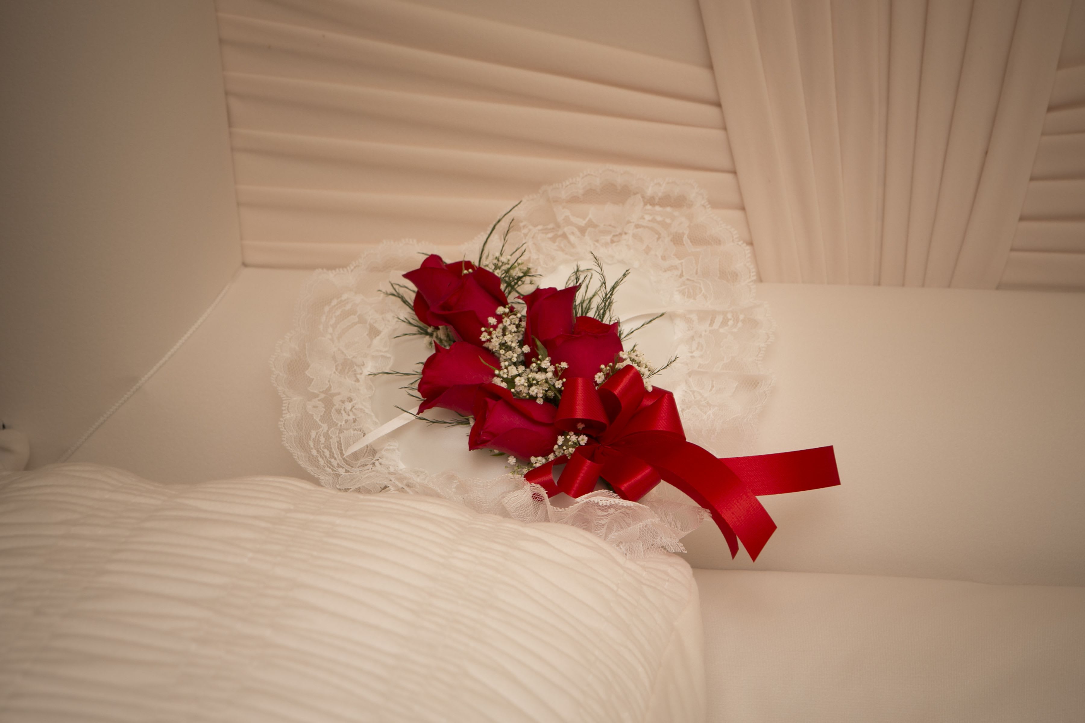 Satin Casket Heart Satin Casket Heart - Satin Casket Heart created in roses. Please let us know what color roses you would like in the special instructions box on the order form and where the arrangement should be sent. Our staff will give your order the care it deserves. Order by 10am to ensure delivery for 2pm showings at wakes. Flowers may be substituted to ensure quality. As Shown : BF-CX1