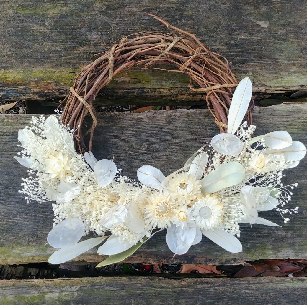 Dried White Wreath Dried White Wreath - Delicate display of dried goodness! Strawflowers, babies breath and preserved foliage make a striking 10" display!