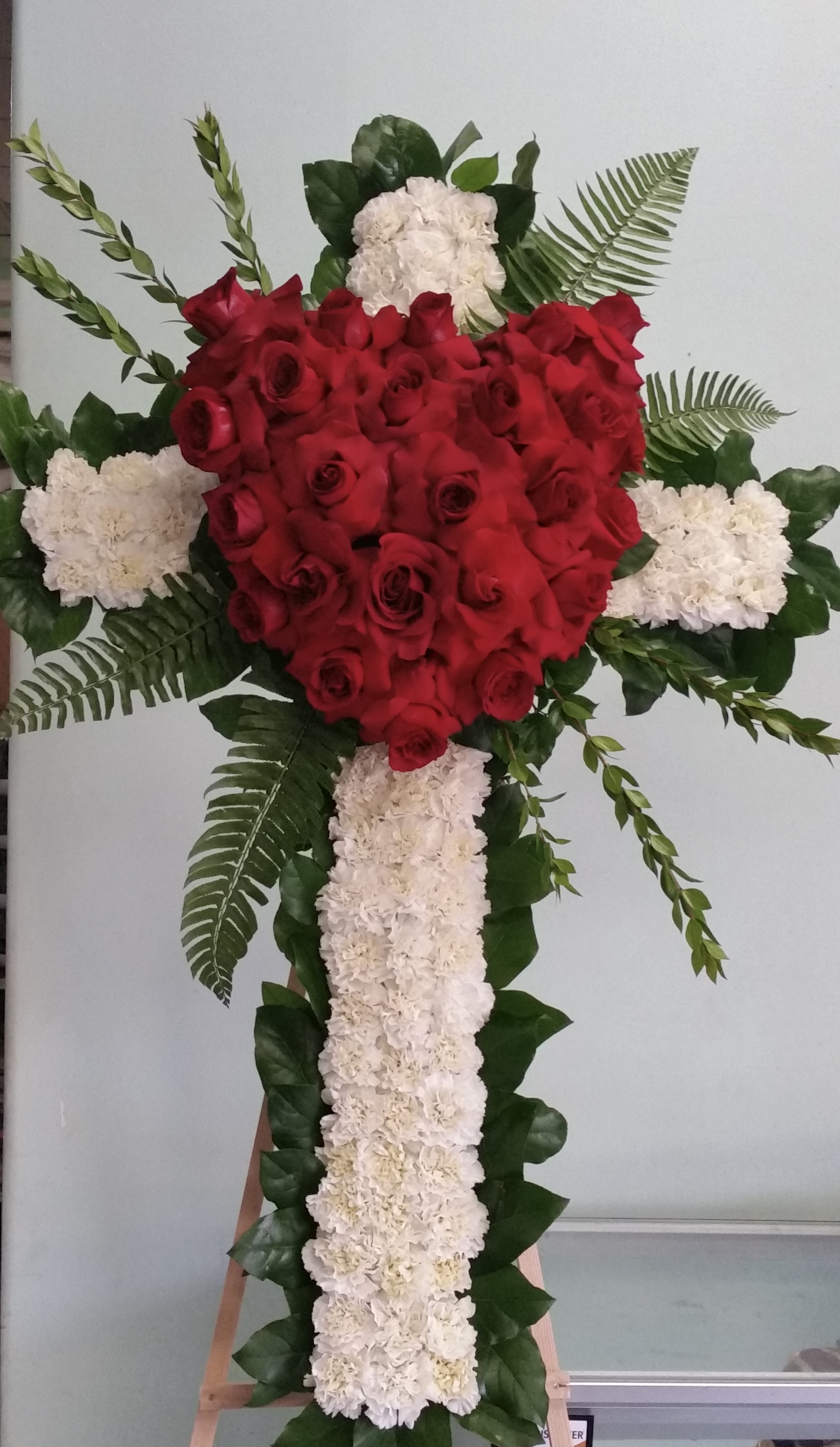 Cross of Love - Cross with red roses and white carnations.