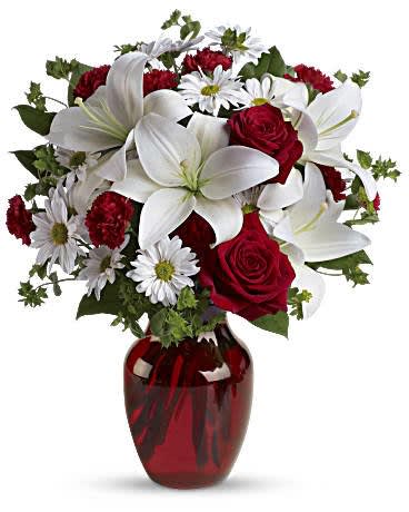 Be My Love Bouquet with Red Roses Be My Love Bouquet with Red Roses - Add some romance to the holiday season with this rich arrangement of luxurious flowers in classic winter colors. Red roses, snow white lilies and playful daisies are gathered in a ruby red vase she'll use well beyond Christmas! Red roses, white asiatic lilies, white daisy spray chrysanthemums, mini red carnations and sprigs of bupleurum and salal are presented in a graceful red glass vase. Orientation: All-Around