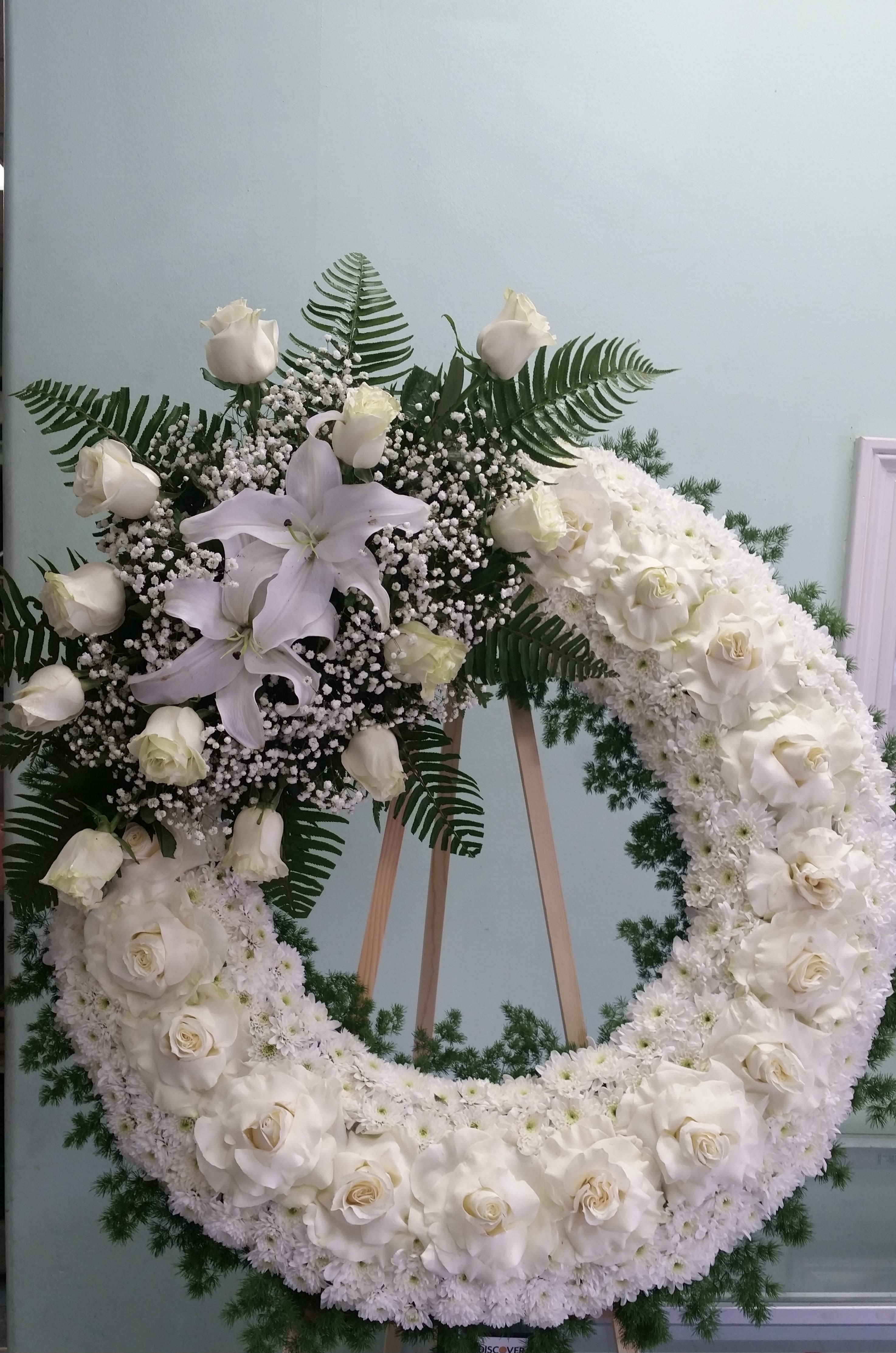 Forever Peace Forever Peace - Open wreath with white roses, daisies, and lilies.