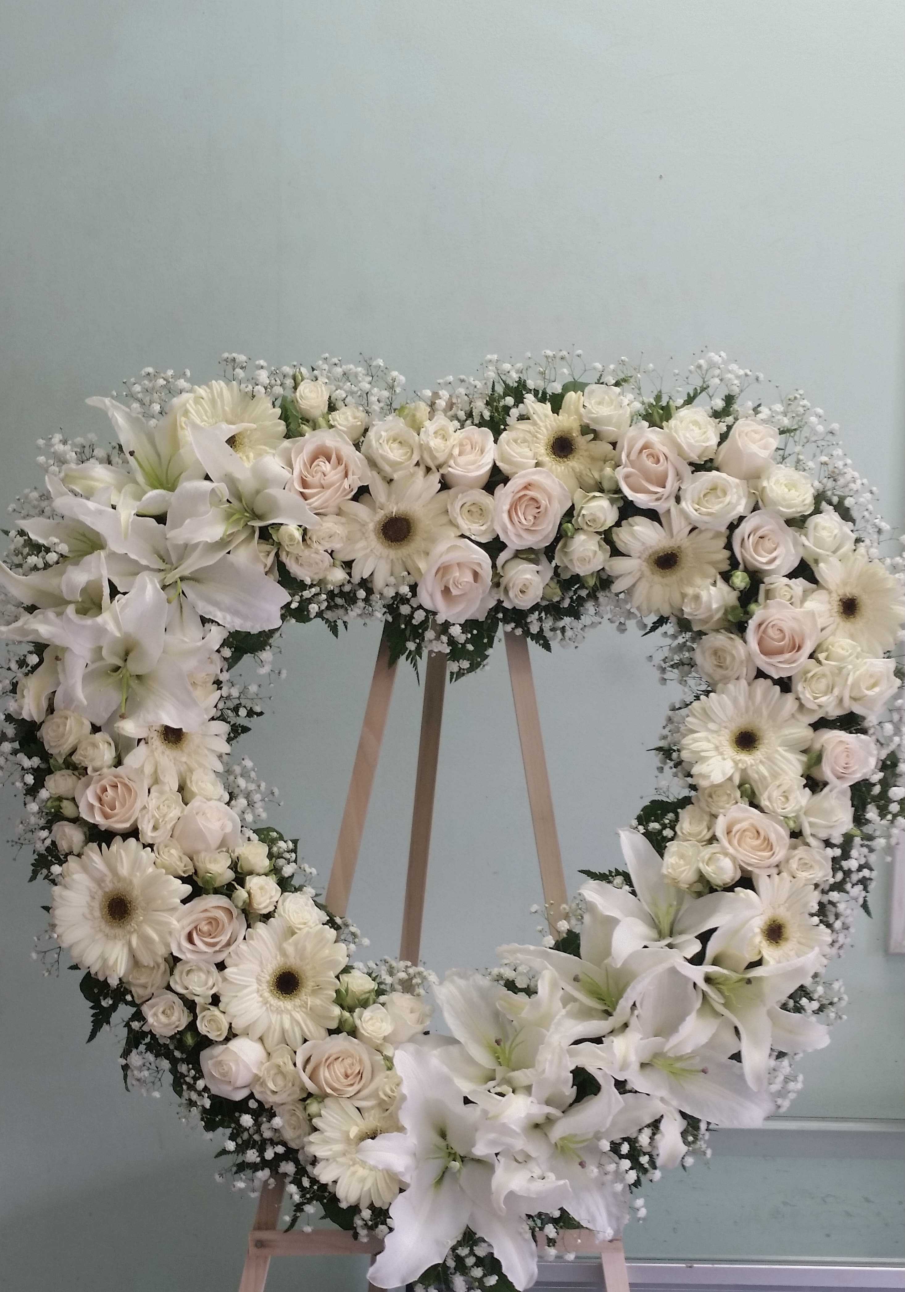 Gentle Soul Gentle Soul - Open heart with light pink roses, white gerbera daisies, white spray roses, and white daisies.