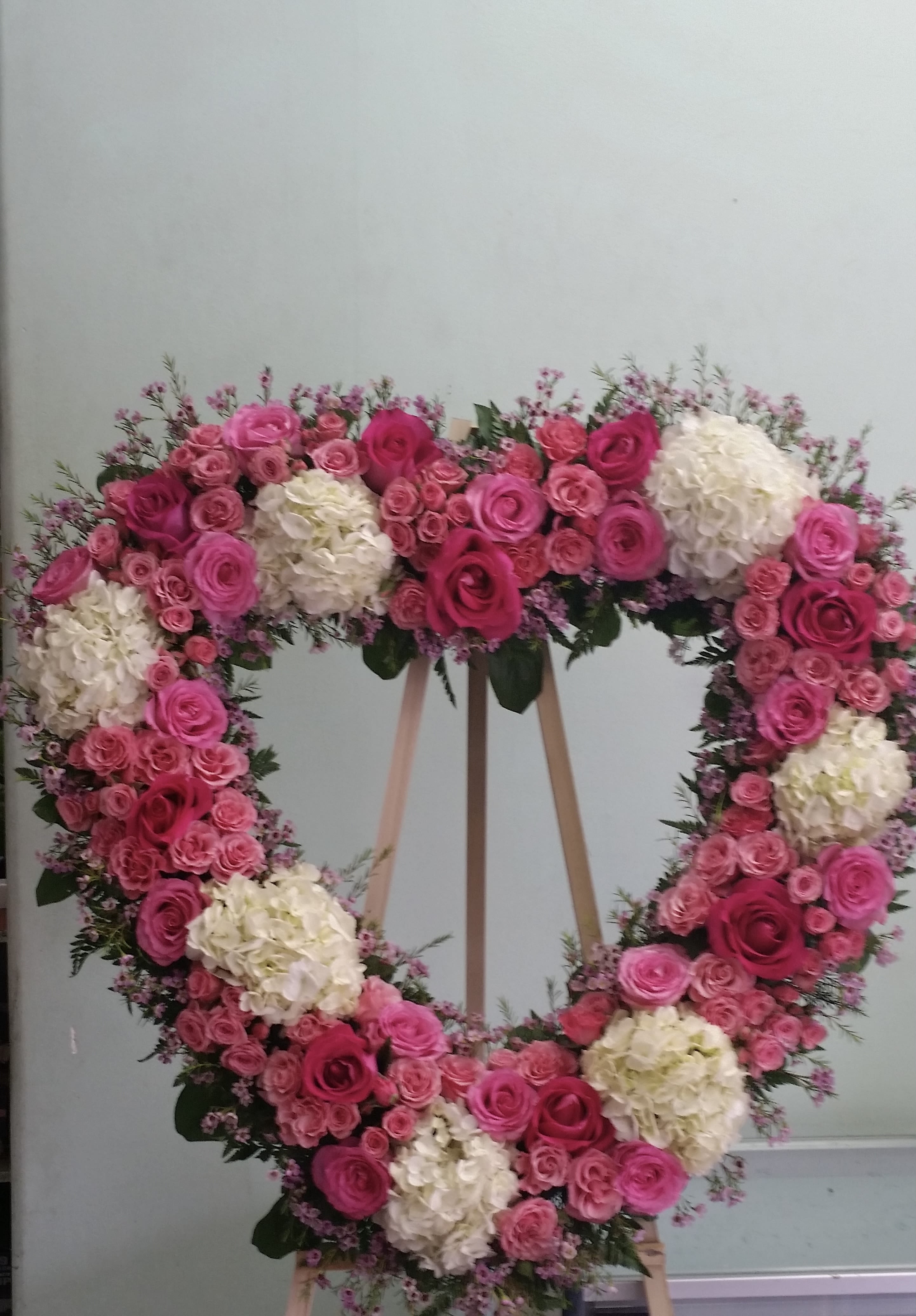 Lasting Embrace Lasting Embrace - Open heart with white hydrangeas, pink roses, and pink spray roses.