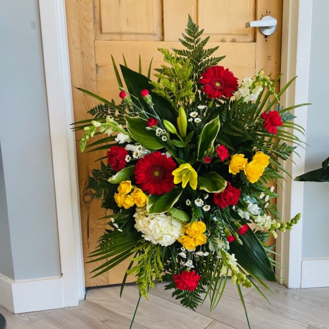 Standing Spray - Photos are examples only. Please contact us with color or flower preferences.  Optional Banners and stands are available at an additional cost.   Approximate measurements for our standard option begin at 32'' tall by 22'' wide