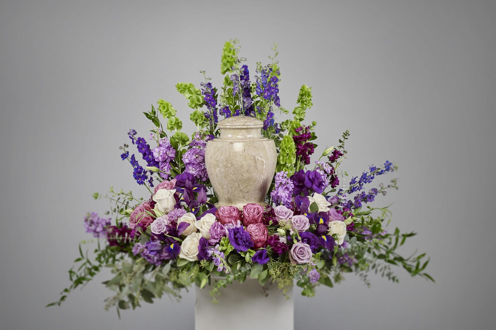 Pink and Lavender Urn Wreath  - Devotion is expressed and beautiful memories cherished with this deep-hued and softly elegant wreath. A lovely reminder of your affection and respect. 