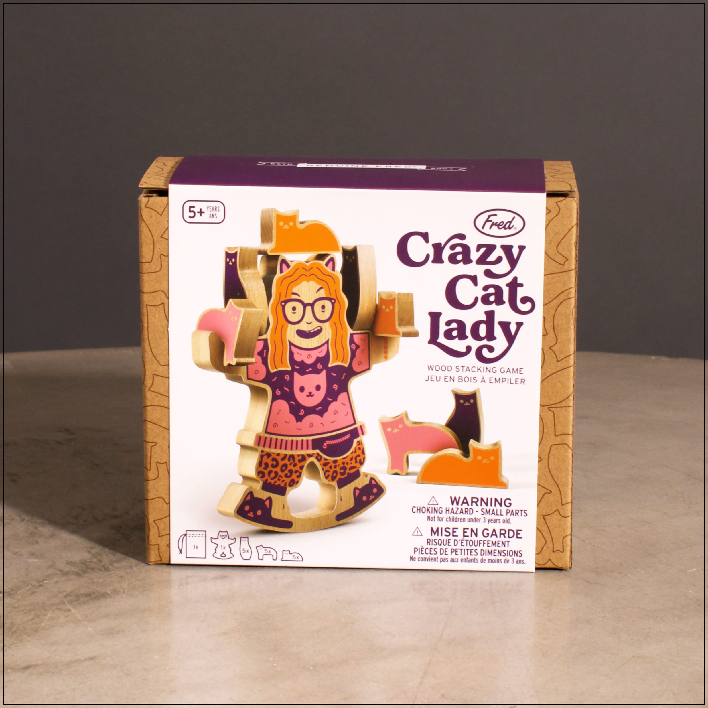 Crazy Cat Lady Stacking Game Crazy Cat Lady Stacking Game - Crazy Cat Lady is the go-to game for those with an affinity for felines. Your goal is to stack and balance the most cats on the wobbling lady without them toppling over. Finally, a situation where you can keep adding cats, and no one can tell you there’s too many! Each set is made of solid beechwood and includes 1 crazy cat lady base, 15 cats, and a muslin storage bag.