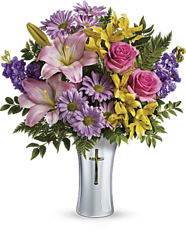 Teleflora's Bright Life Bouquet Teleflora's Bright Life Bouquet - At once radiant and reverent, this colorful bouquet of roses, lilies and alstroemeria is beautifully arranged in a ceramic, silver-finished vase with cross cut-out - a touching tribute to a bright life and your unending support. This glorious arrangement includes hot pink roses, pink asiatic lilies, yellow alstroemeria, lavender stock, lavender daisy spray chrysanthemums, huckleberry and leatherleaf fern. Delivered in a Shining Cross vase. Orientation: All-Around
