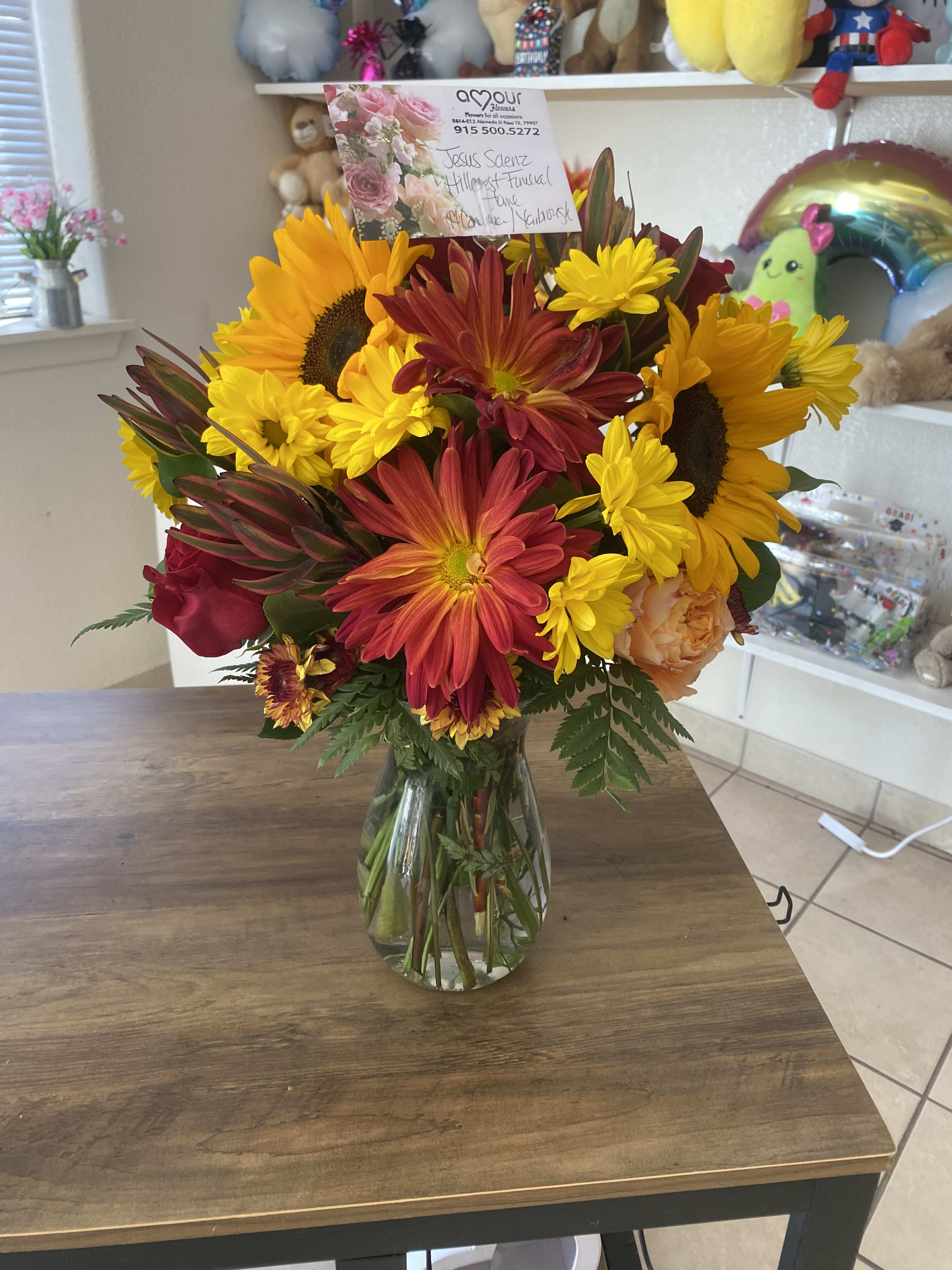 Harvest Beauty Harvest Beauty - A beautiful array of fall colored flowers accented with sunflowers!