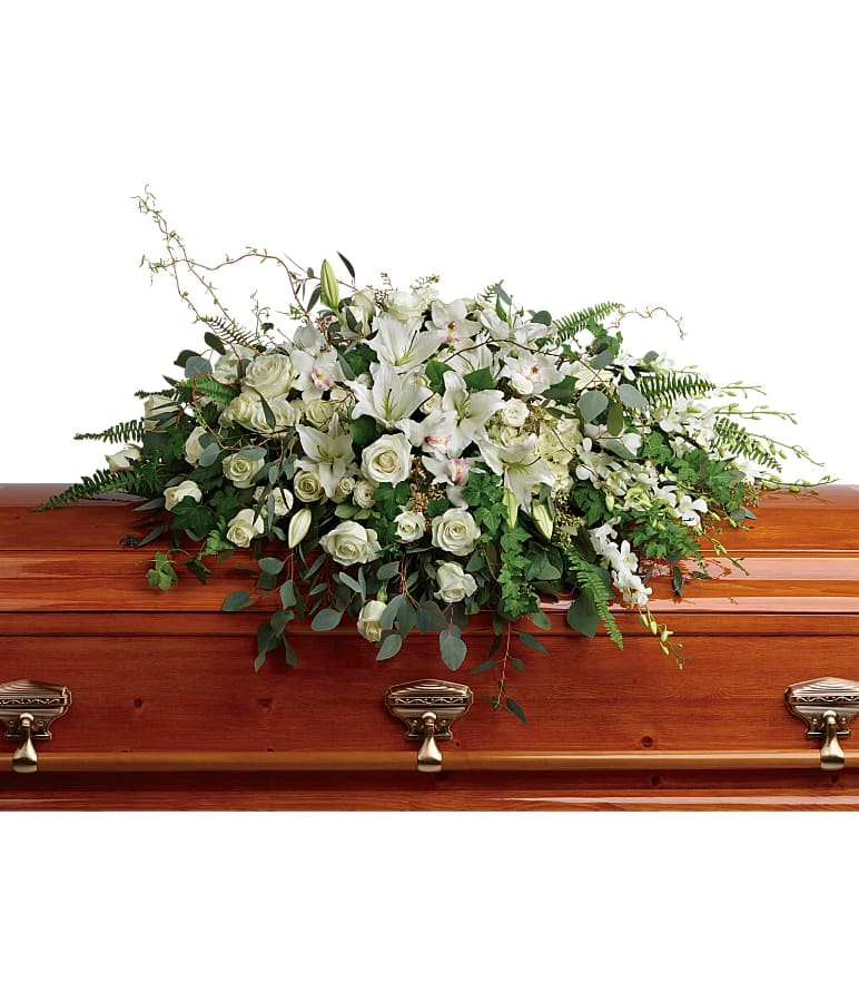 Grandest Glory Casket Spray - As serene as gently falling snow, this pure white spray of hydrangea, orchids, roses and lilies is a heartfelt symbol of peace and beauty--a symbol that will remain a guiding light to your loved ones for years to come. This stunning spray features white hydrangea, white cymbidium orchids, white dendrobium orchids, white roses, white spray roses, white oriental lilies, curly willow, green ivy, parvifolia eucalyptus, seeded eucalyptus, silver dollar eucalyptus, sword fern, and lemon leaf. Approximately 48 1/2&quot; W x 33&quot; H