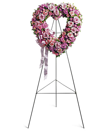 Rose Garden Heart Rose Garden Heart - In the shape of a heart, and accented with a pink satin ribbon, this garden of delicate blooms is a tender and classic tribute to a precious life, and a cherished expression of love and sympathy. Beautiful flowers such as light pink roses, hydrangea and miniature carnations mix with lavender chrysanthemums on an open heart-shaped wreath. Orientation: One-Sided SUBSTITUTION POLICY – Always deliver the freshest flowers! Please note the bouquet pictured reflects our original design. If the exact flowers or container in this arrangement are not available, our local florists will create a beautiful bouquet with the freshest available flowers.