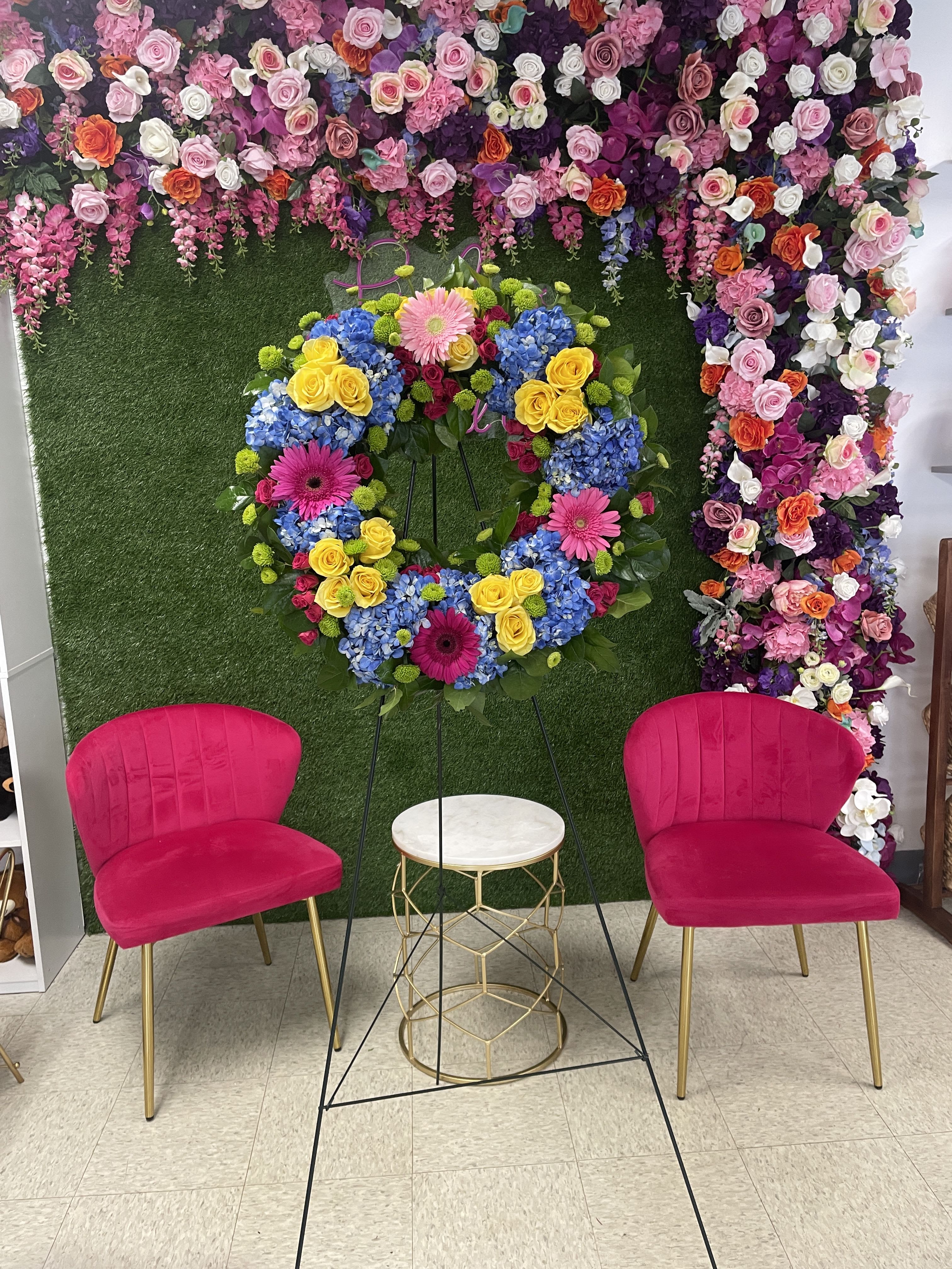 Vivid Spring  - This colorful and bright wreath spray is representative of a life lived to its fullest. Colors and Flowers may change based off of season and availability. 