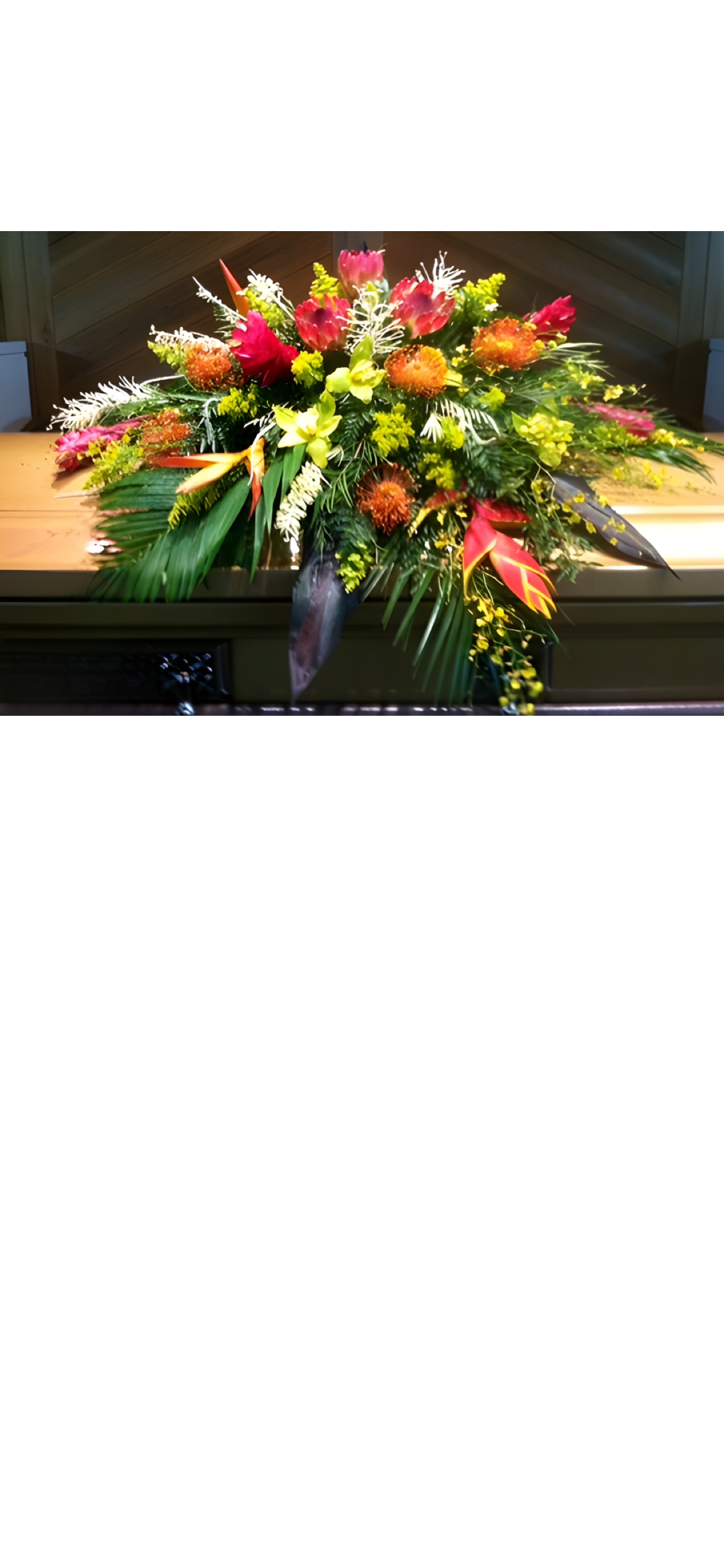 Royal  Oasis  Package  - Adorn the room with an expression of love in a tribute of  locally grown tropical flowers . Bright, bold and beautiful colors . Comes with casket or urn spray , wreath and pedestal arrangement .
