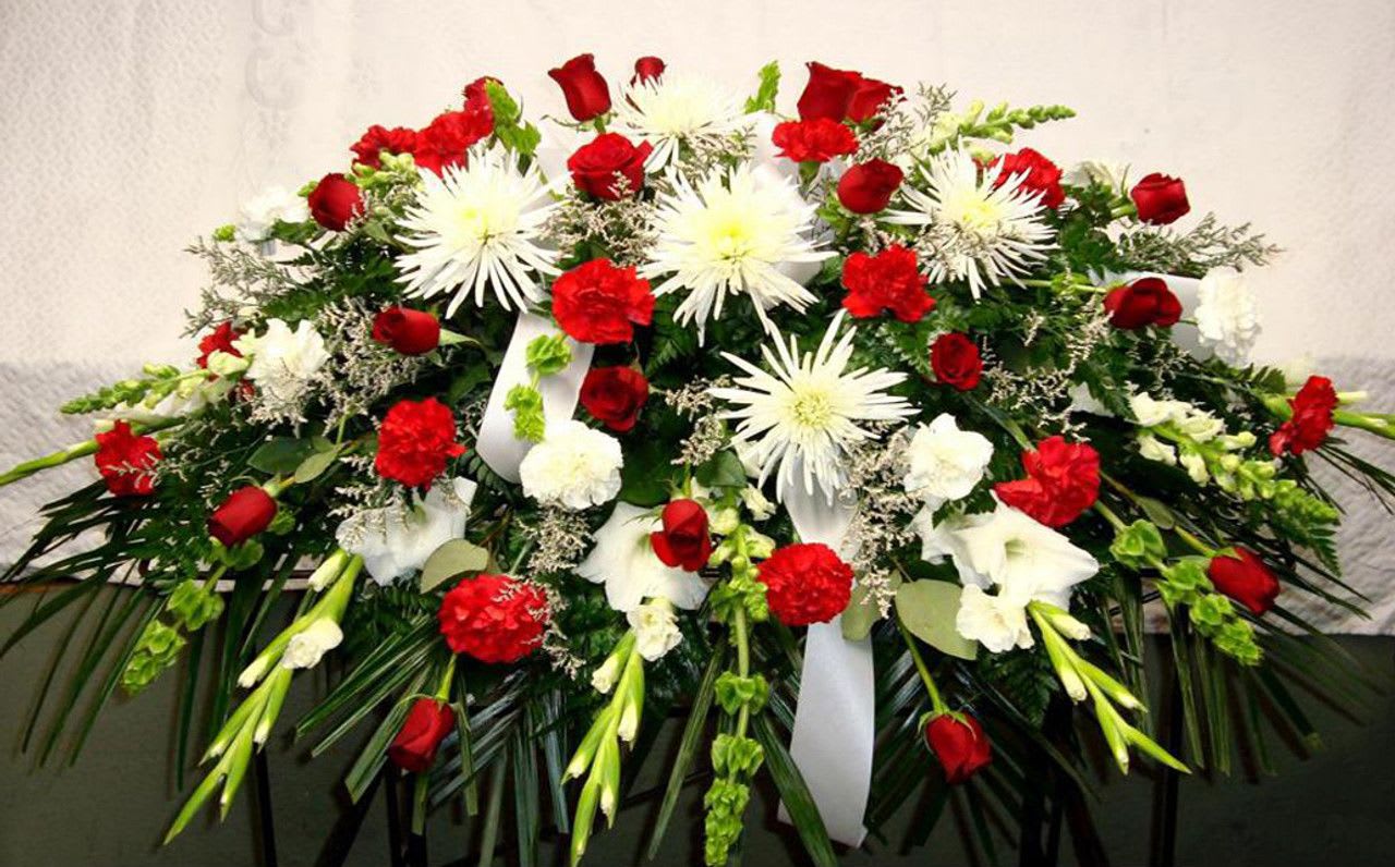 Red and White Casket Spray - Red and white casket spray made with Roses, Carnations, Glads, Bells of Ireland, and Fuji mums.