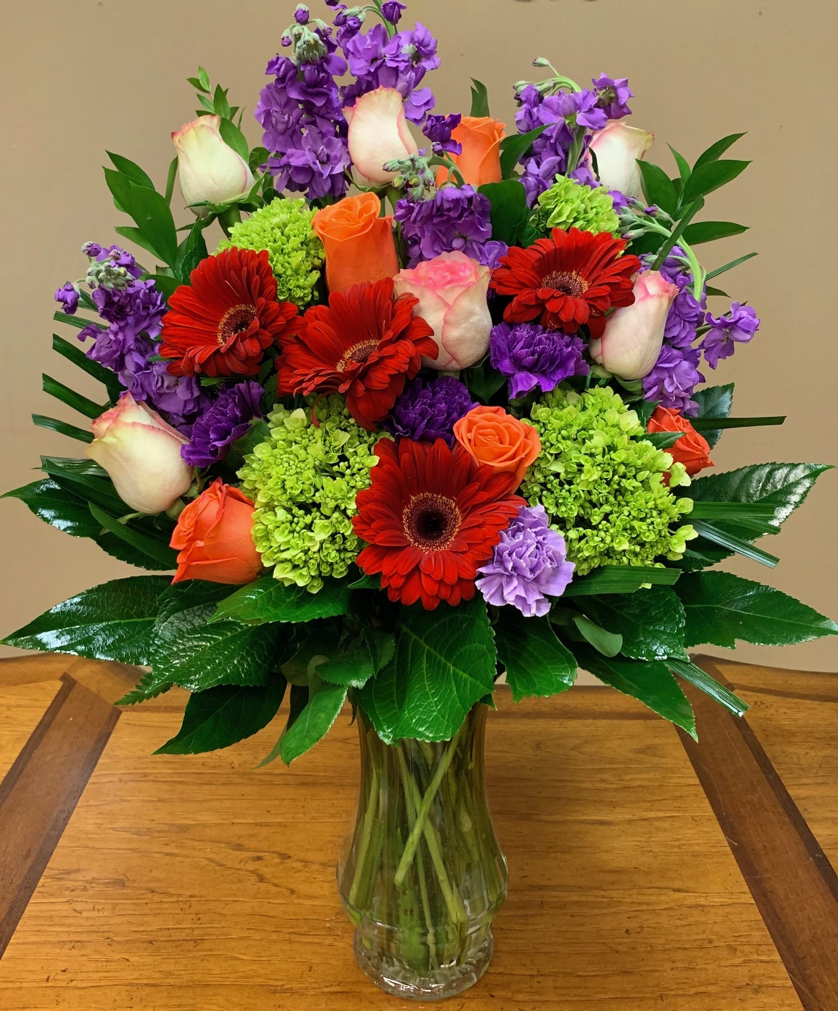 &quot;Best Day&quot; Flowers Las Vegas - Our Best Day bouquet is ready to create a moment your recipient will always remember. Orange roses, pink roses, purple stock, purple carnations, red gerberas, green hydrangeas and greens in a clear glass vase makes this day their best day.