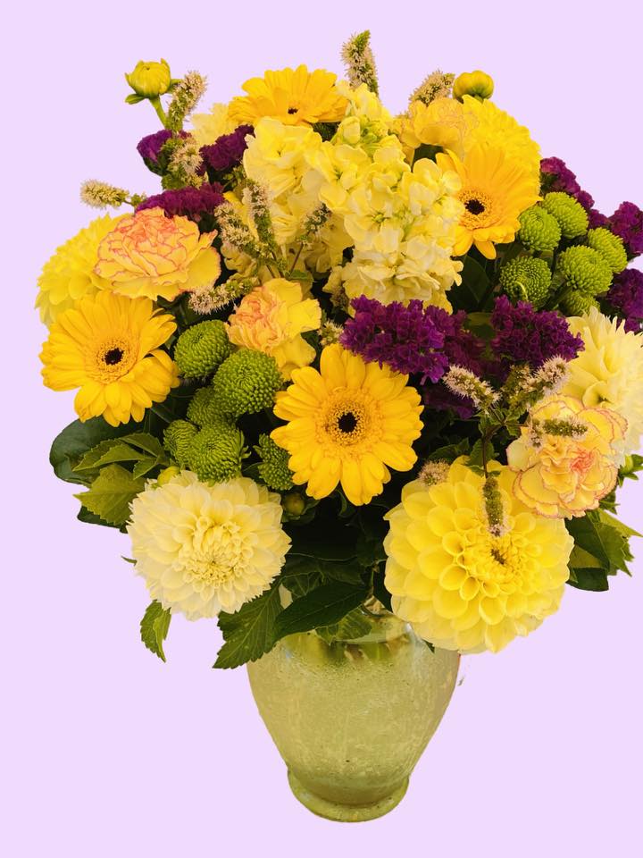 Cheerful yellow  - An artistic and bright arrangement is a pleaser and interesting as it is impressive. Bright Yellow, and Purple is an architectural design give this arrangement its unique appeal.   APPROXIMATE DIMENSIONS       12&quot;W X 18&quot;H Standard                                                            14&quot;W X 22&quot;H Deluxe                                                           16&quot;W X 25&quot;H   Premium  