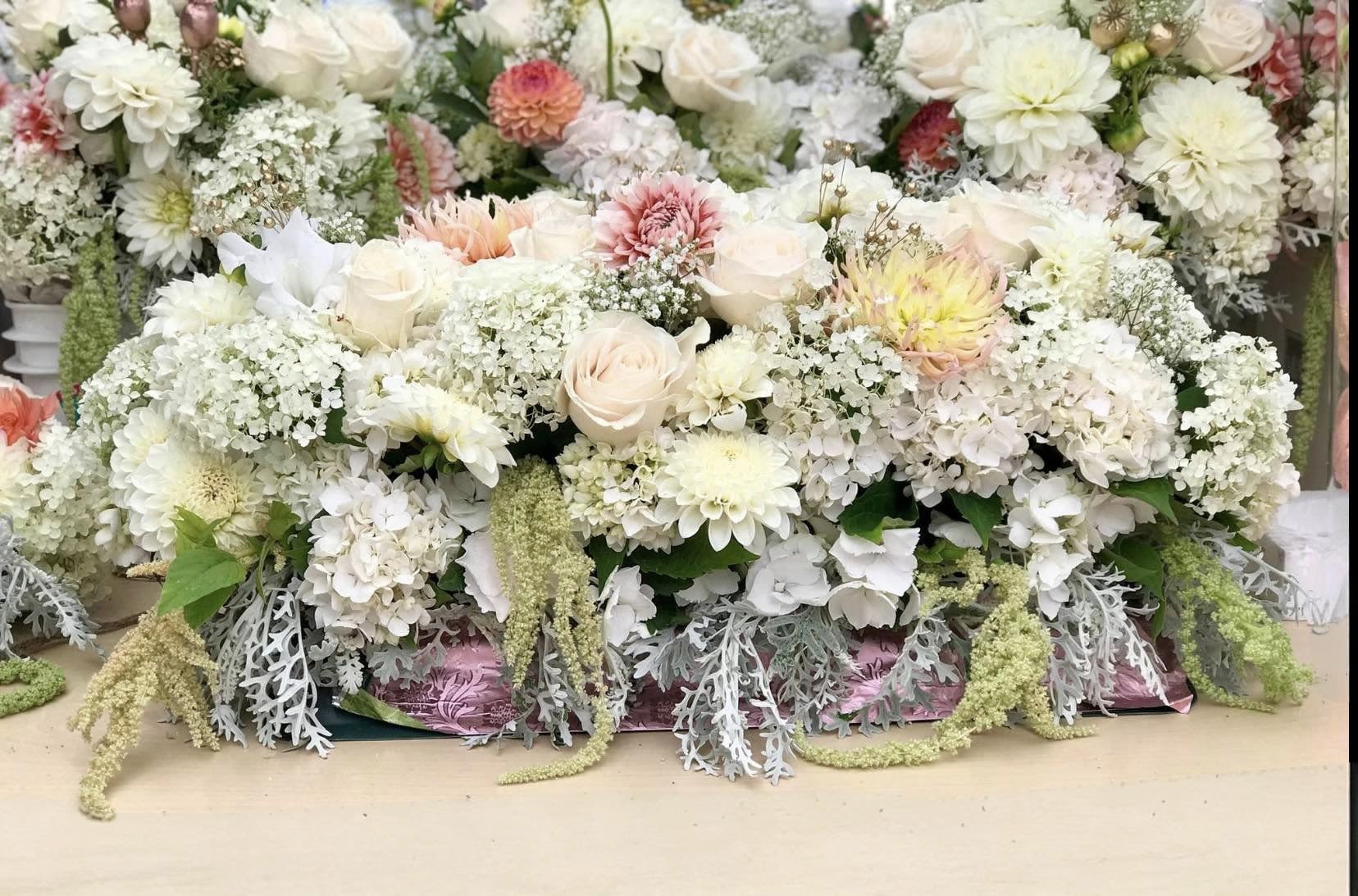 Freshstart Freshstart - An artistic and soft arrangement with a little warm tone, this Altar pleaser is as interesting as it is impressive. Soft white with a touch of warm color and an architectural design gives this arrangement its unique appeal. APPROXIMATE DIMENSIONS 20" W X 12" H Standard 22" W X 14"H Deluxe 25" W X 16" H Premium