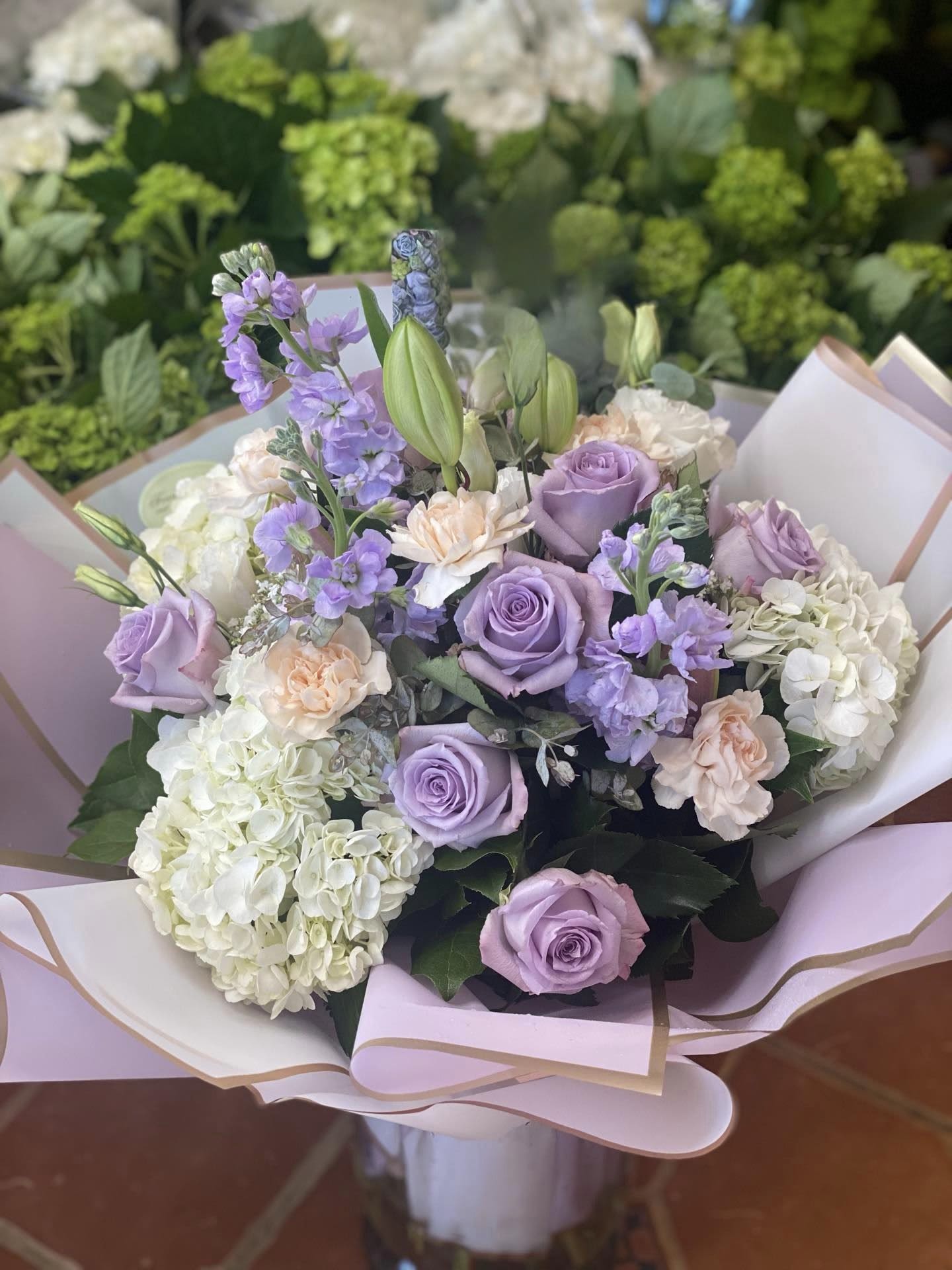 Loverly Lavender  - An artistic and soft arrangement is a pleaser and interesting as it is impressive. Lavendar, soft pink and White is an architectural design give this arrangement its unique appeal. Wrap or Vase same price  APPROXIMATE DIMENSIONS       12&quot;W X 18&quot;H Standard                                                            14&quot;W X 22&quot;H Deluxe                                                           16&quot;W X 25&quot;H   Premium  