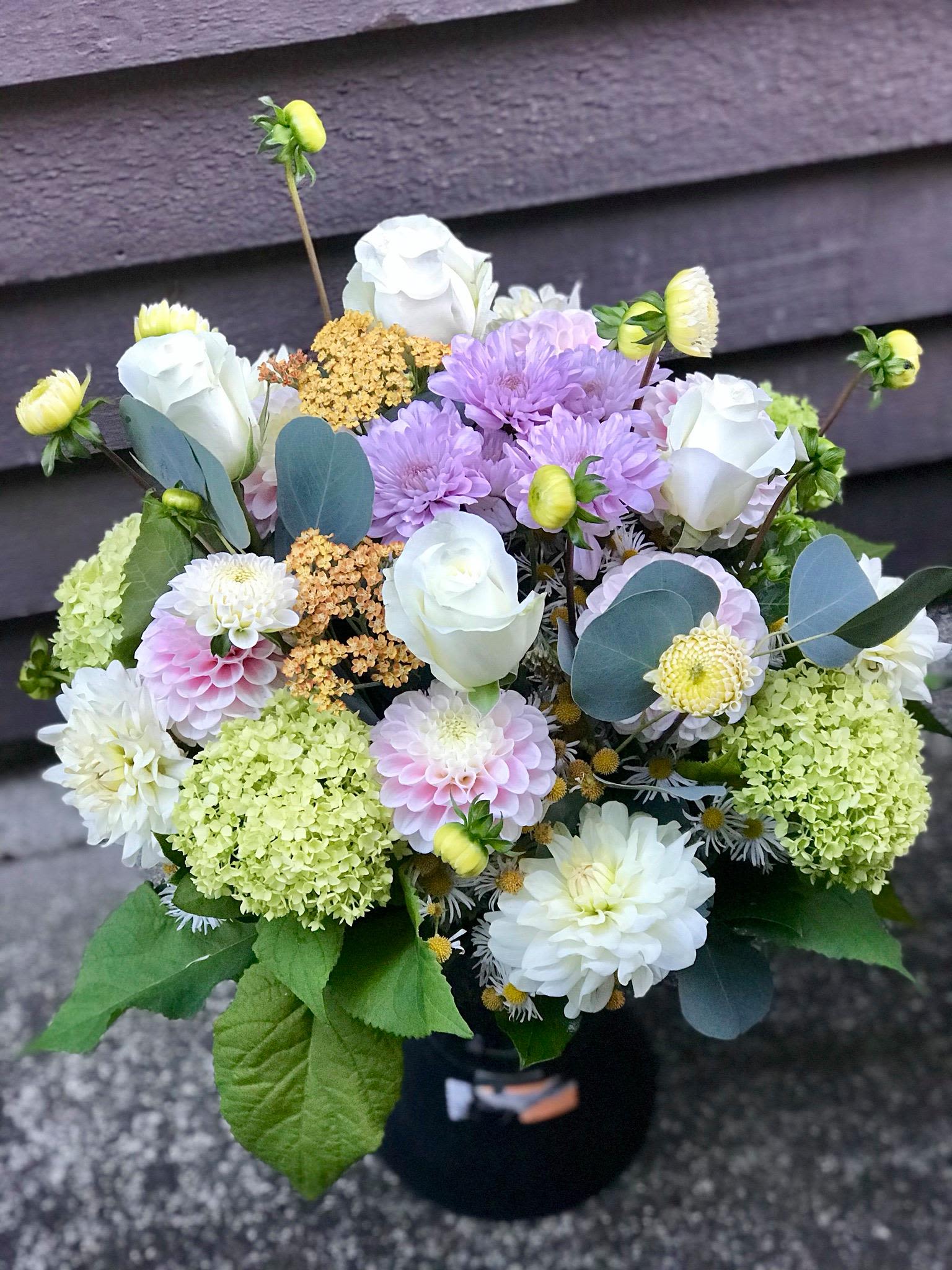 Faithful - An artistic and soft arrangement is a pleaser and interesting as it is impressive. Lavendar, soft pink, green and White is an architectural design give this arrangement its unique appeal. Wrap or Vase same price  APPROXIMATE DIMENSIONS       12&quot;W X 18&quot;H Standard                                                            14&quot;W X 22&quot;H Deluxe                                                           16&quot;W X 25&quot;H   Premium  