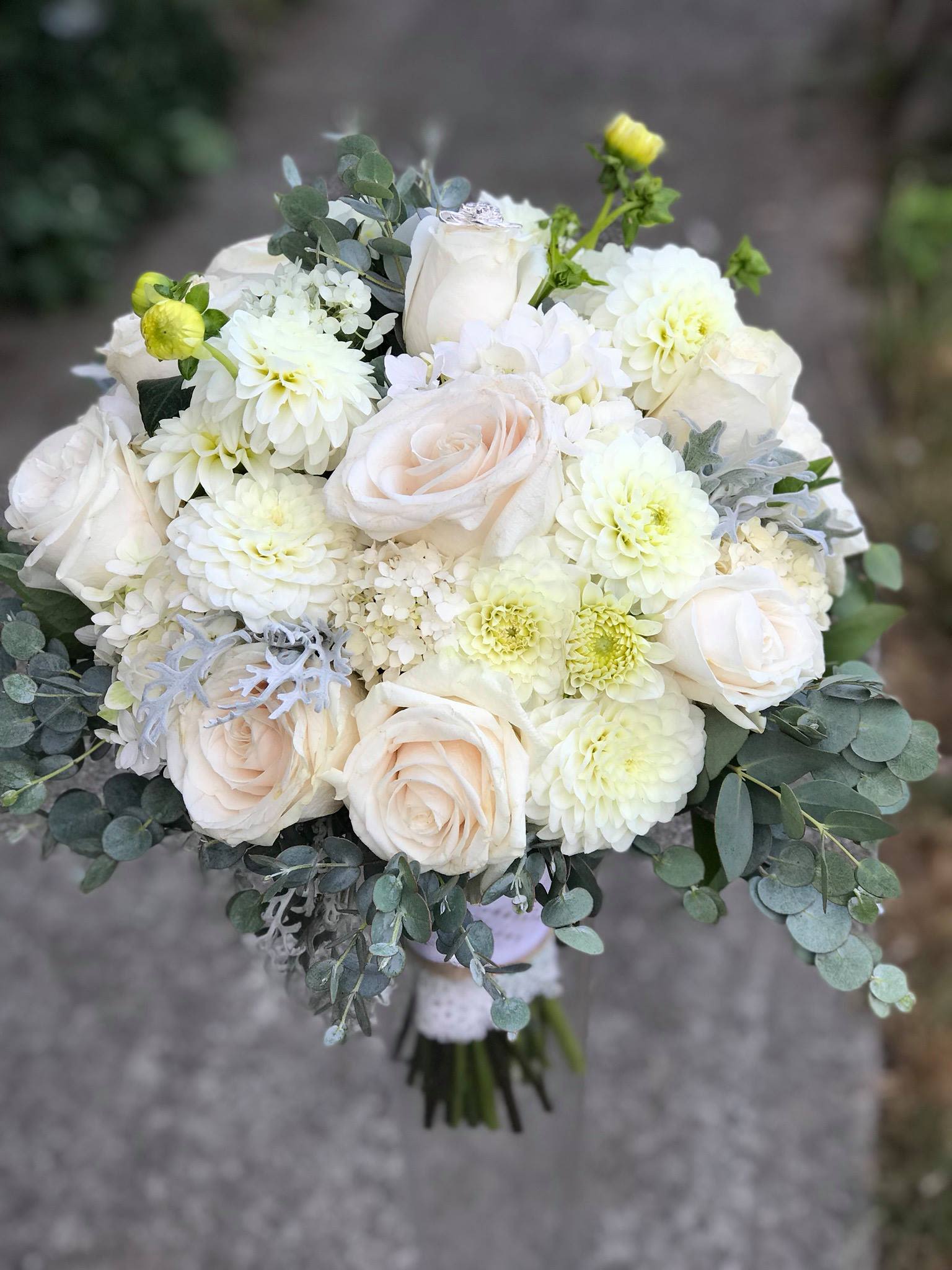 Peaceful Peaceful - An artistic and soft and holy arrangement is a pleaser and interesting as it is impressive. Cream and White is an architectural design give this arrangement its unique appeal. Wrap or Vase same price APPROXIMATE DIMENSIONS 12"W X 18"H Standard 14"W X 22"H Deluxe 16"W X 25"H Premium