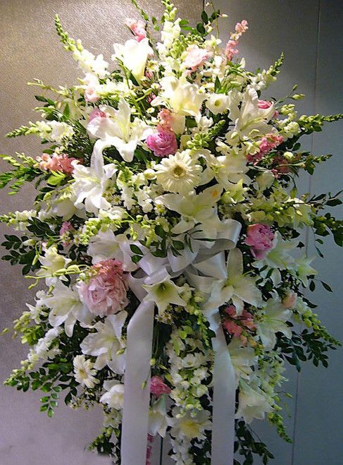 Pink and White Standing Spray - Pink and white standing spray made with Lilies Assorted, Hydrangea, Snapp Dragons, Orchids, Gerbera Daisies and Larkspur.
