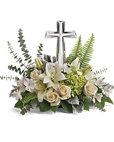 Life's Glory Bouquet by Teleflora - This reverant bouquet of serene white flowers is a beautiful sharing of sympathy, adorned with a majestic crystal cross keepsake. Green hydrangea, crème roses, white asiatic lilies, and white alstroemeria are accented with dusty miller, sword fern, spiral eucalyptus, and lemon leaf. Delivered with Teleflora's Large Crystal Cross Keepsake. Orientation: One-Sided