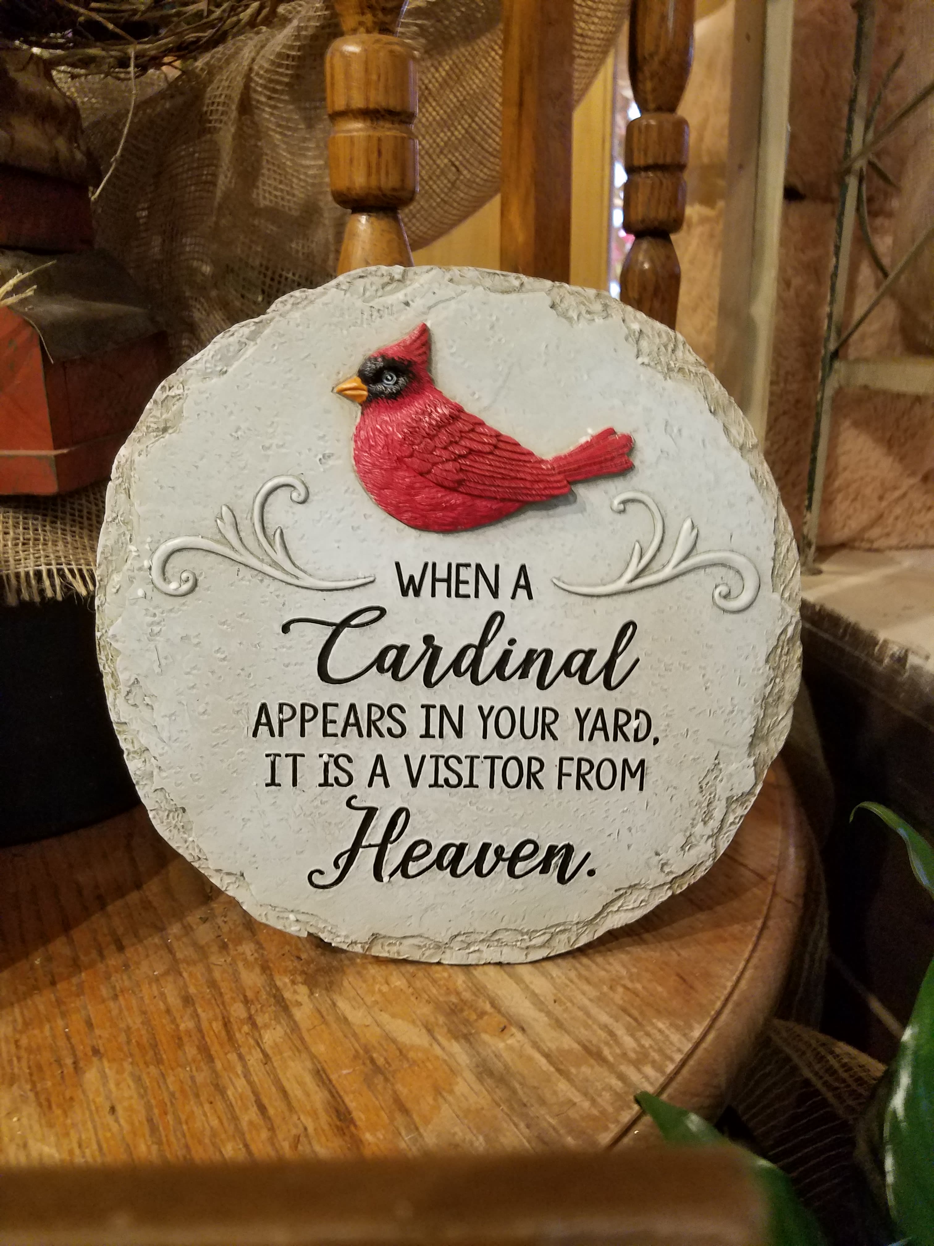 Eckert Florist's "...Visitor from Heaven" Round Cardinal Memorial Stone **LOCAL DELIVERY ONLY** Eckert Florist's "...Visitor from Heaven" Round Cardinal Memorial Stone **LOCAL DELIVERY ONLY** - **LOCAL DELIVERY ONLY* Resin round stone measures approx.11" This nice memorial keepsake may be sent to a funeral/memorial service or home. *May be added to a fresh arrangement or green plant. See Deluxe and/or Premium upgrades. *See Add-on Section for Display Easel