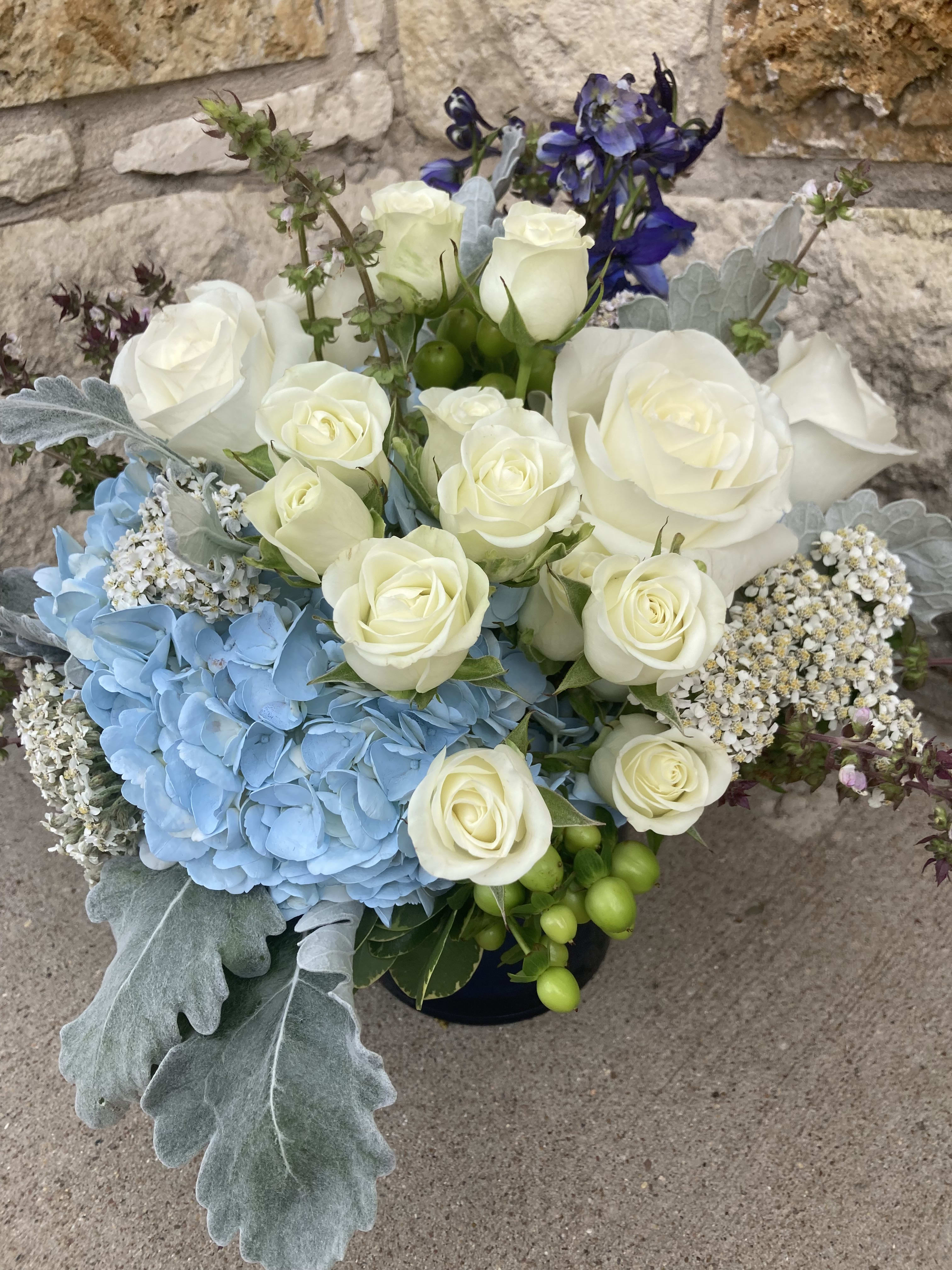 Frothy Blue Wave Frothy Blue Wave - White roses bubble up from the blue hydrangea and delphinium wave