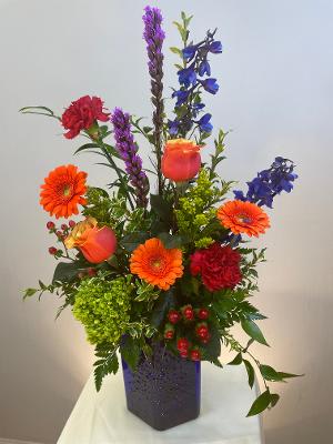 Tall & Vibrant - Blue Tall & Vibrant - Blue - A mixture of our brightest flowers in our distinctive "Starburst" vase. So bright and cheerful!