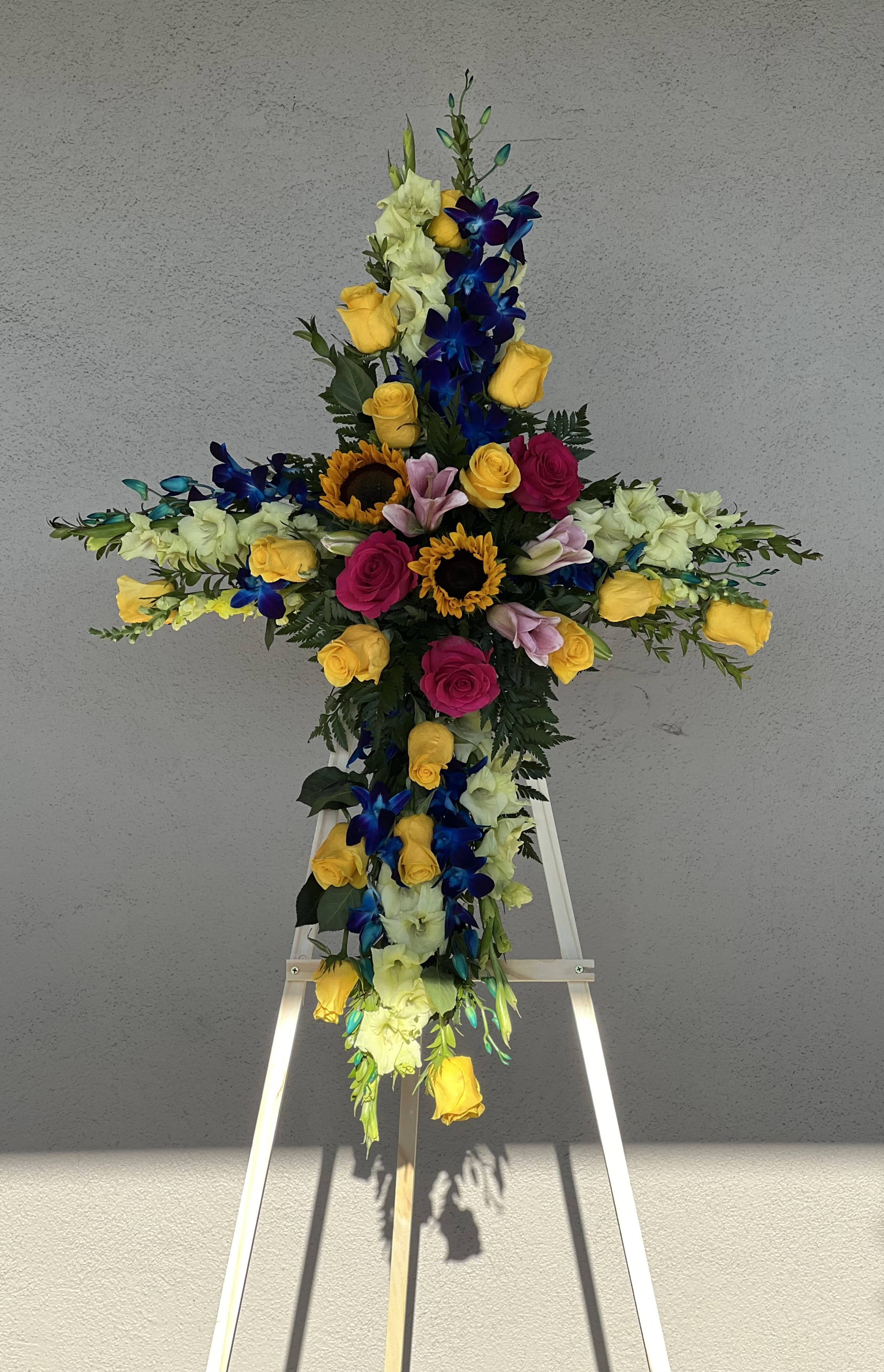 Radiant Cross Radiant Cross - Beautiful colorful cross on an easel made of missed flowers