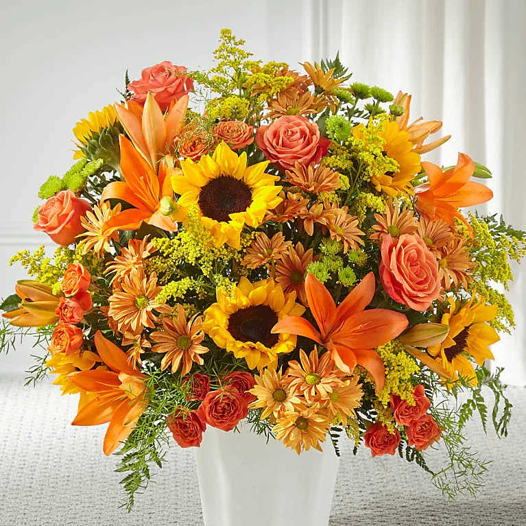 Harvest Thoughts Floor Basket - Harvest Thoughts Floor Basket As the weather changes, Autumn is on their mind. Composed of sunflowers, lilies, and roses, our Harvest Thoughts is a beautiful gesture for birthdays, sympathy, or just because.