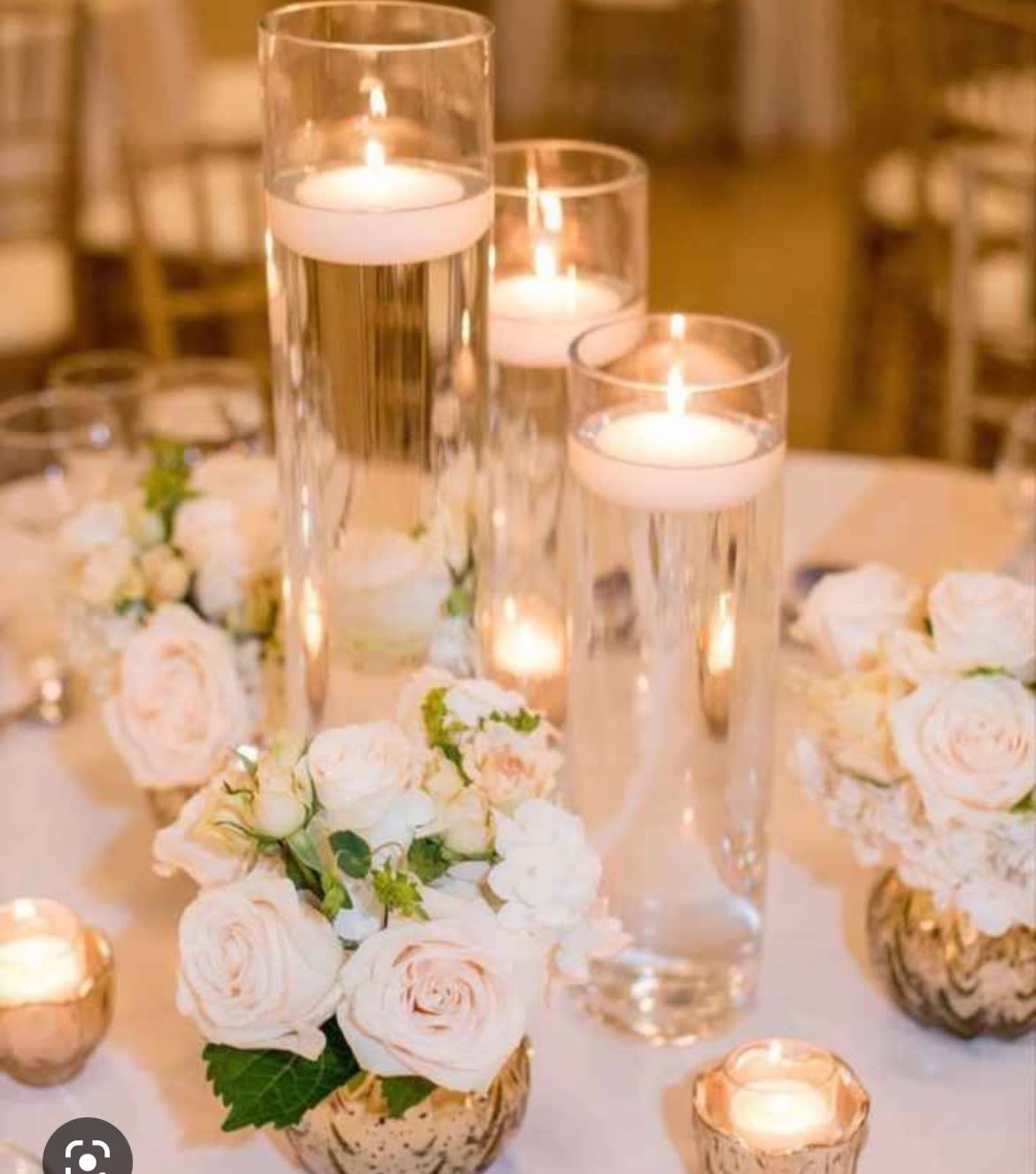 Table decoration - 6 sets of cylinder vases with floating candles 10 gold vases with off white roses and hydrangeas 20-24 Small gold candles 
