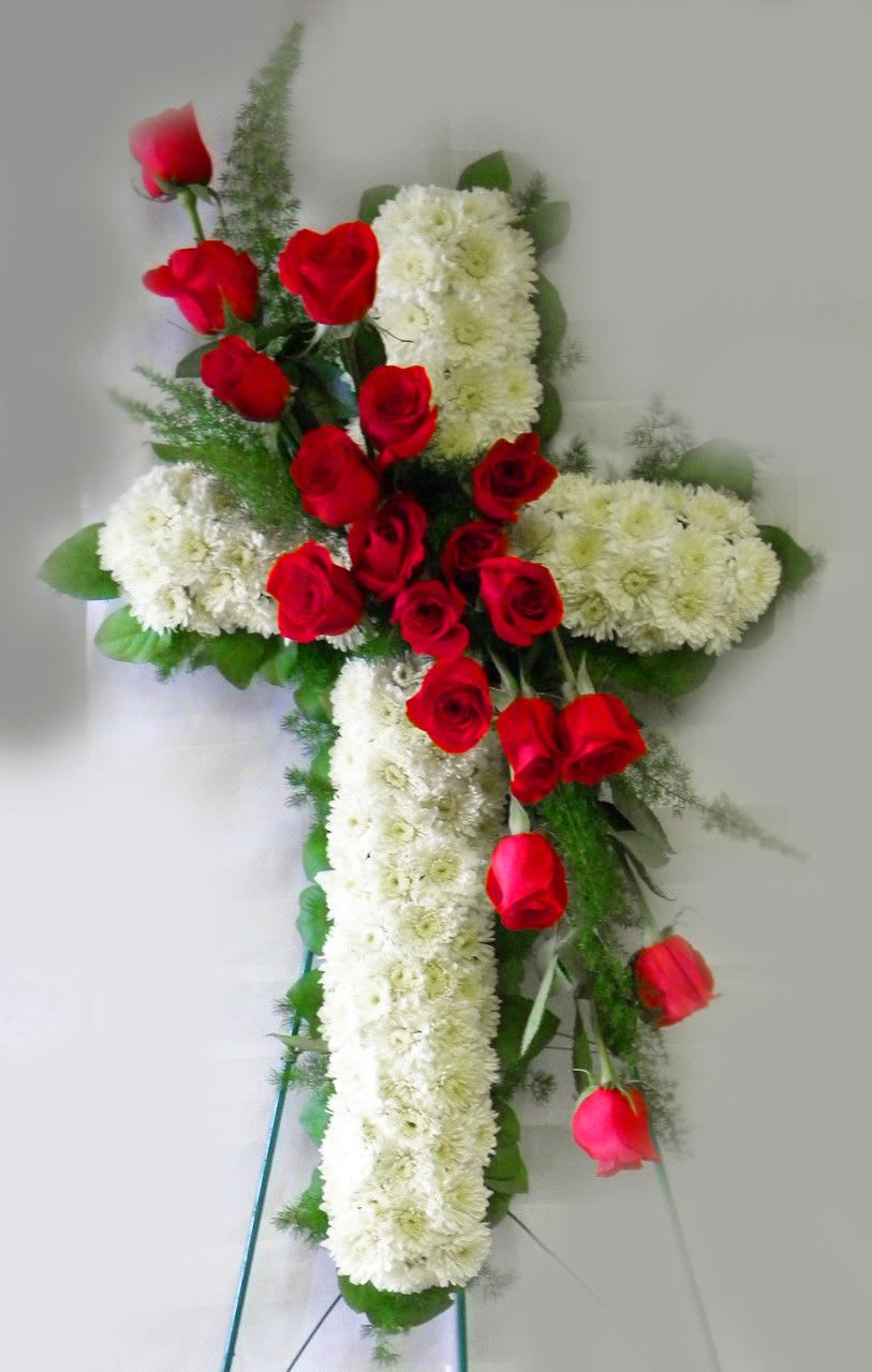 THE HOLY CROSS THE HOLY CROSS - The Holy Cross made from cushion pomps and red roses.