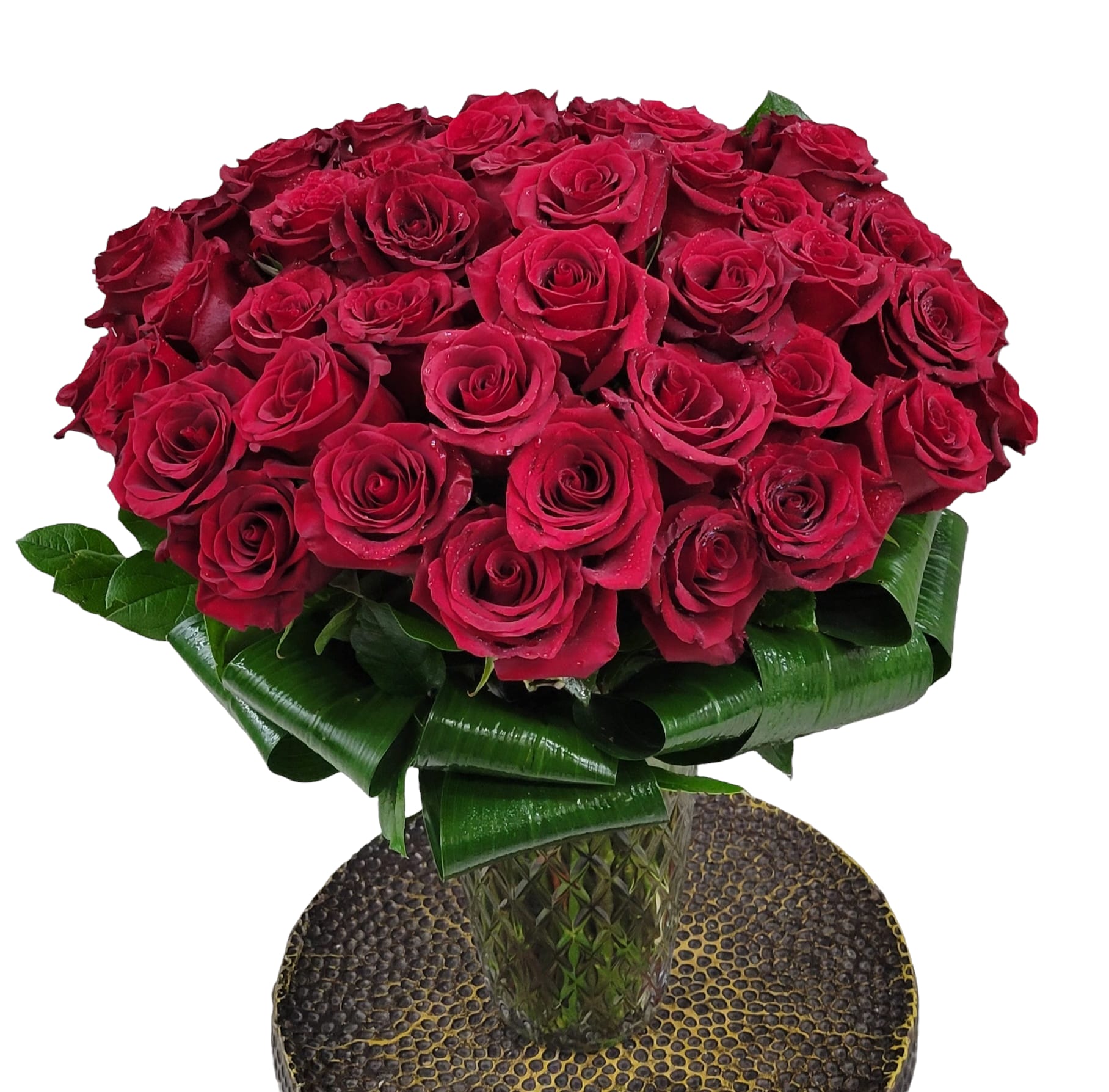 50 Kisses - Indulge in the epitome of elegance with our luxurious arrangement featuring 50 long-stemmed red roses gracefully presented in a stunning vase. Each bloom exudes timeless beauty, making it the perfect expression of love, passion, and sophistication. Elevate any occasion with this breathtaking display of opulence and romance.