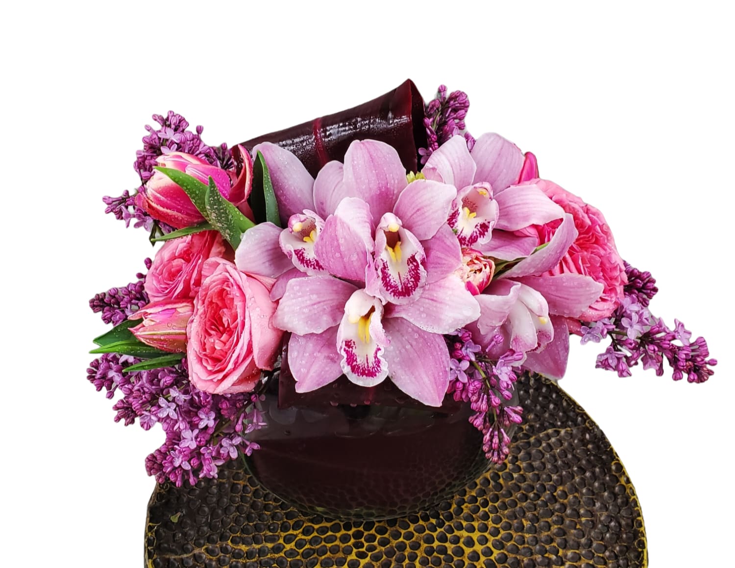 Pretty in Pink - Delicate pink garden roses, graceful pink cymbidium orchids, and whimsical pink tulips come together in perfect harmony. This enchanting ensemble exudes elegance and grace, evoking feelings of romance and tranquility. Let its soft hues and delicate fragrance transport you to a garden oasis of serenity and charm.