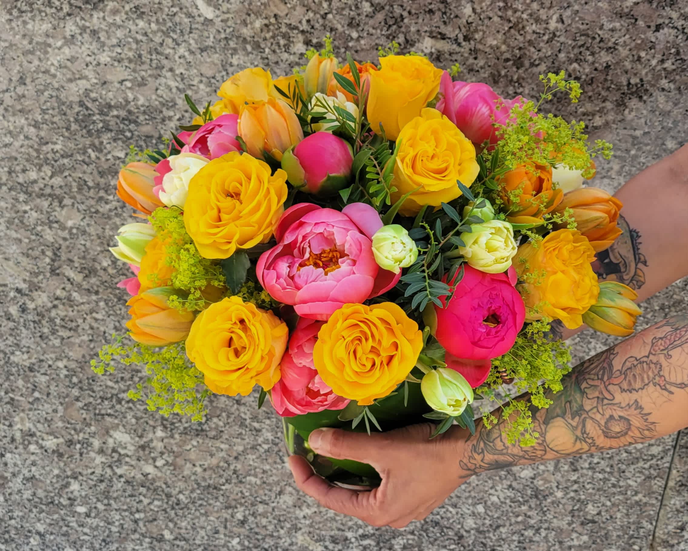 Mama's Delight - Delight Mom with a vibrant floral arrangement featuring the timeless elegance of yellow roses intertwined with the delicate beauty of pink peonies. This enchanting combination captures the essence of warmth and affection, making it a perfect tribute to her grace and love.