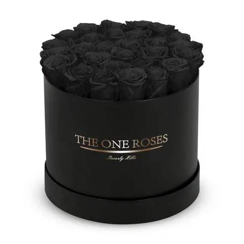 Round Flat | Classic Black Box onyx black Round Flat | Classic Black Box onyx black - The "runway round collection" consists of unique, real preserved roses in classic round handcrafted luxury soft touch box with a top. About 25-30 stems of the one long lasting (med size) preserved roses.  Durability: approx. 1-3 years.  Our roses, which are carefully sourced from the highest quality gardens in Ecuador, are made to represent the eternal yet ephemeral nature of Love itself. Our Roses are specially customized with essential oils to increase the fragrance.  Product Care: DO NOT Water the roses! AVOID direct exposure to sunlight. Keep the arrangement in a room-temperature environment. If dust collects after a few months, remove it lightly using a duster. DO NOT place anything onto the roses as they can crush and damage the roses. DO NOT remove the roses from the box; they are secure and happy there. DO NOT allow roses to have direct contact with light colored fabric or surfaces, as staining may occur. The lid is meant to stay on the side or bottom of the box. Be mindful when carrying the arrangement: it's a very delicate product!