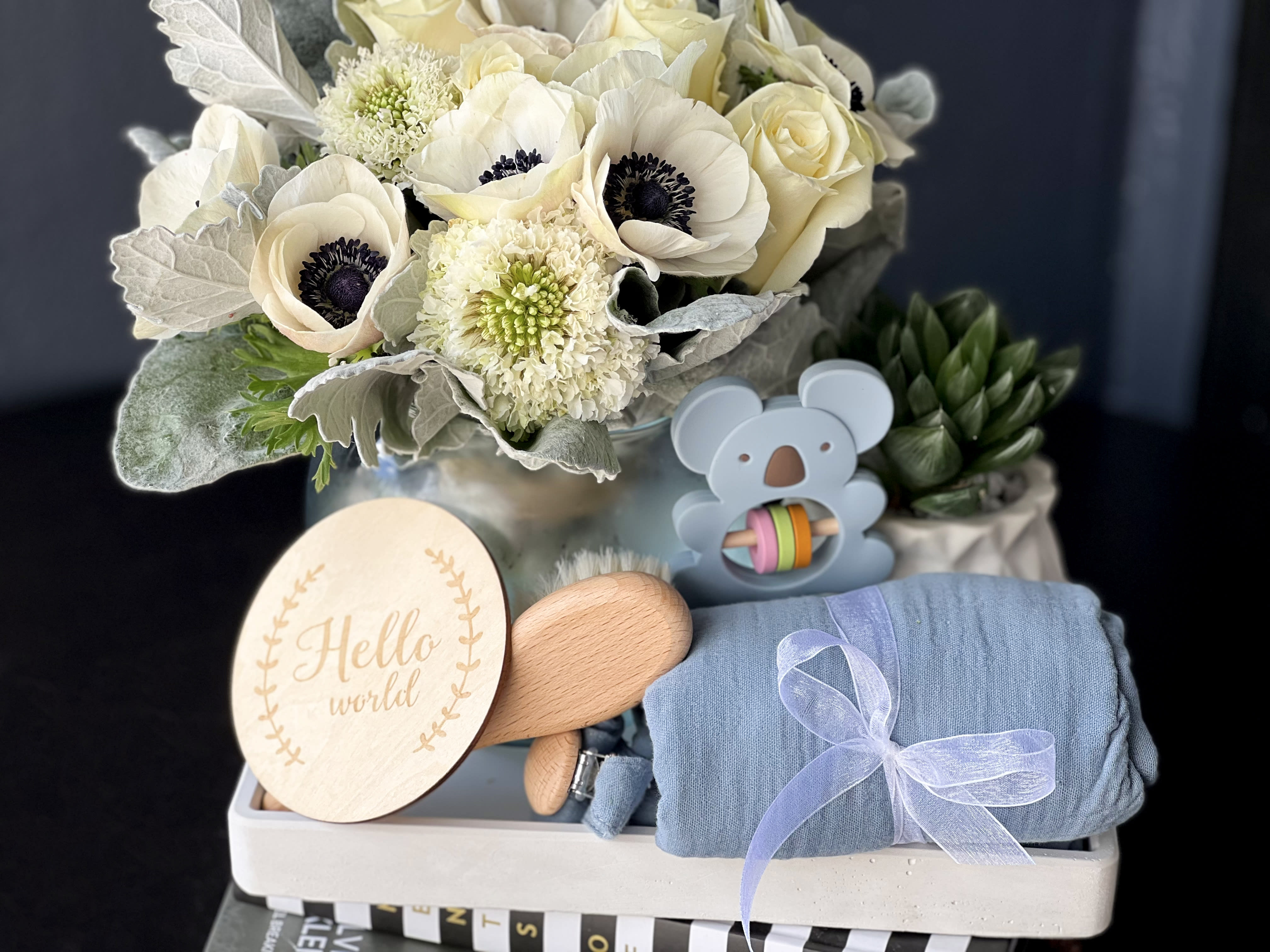 Baby Boy Gift Set  - Details: Stylish gift set for new baby.   Includes: Fresh flower bouquet in a vase, succulent in custom made ceramic pot, handmade cement tray   Baby items:   Wooden Hairbrush Large Muslin Blanket Cloth ( size: 28&quot;x21&quot;)  Double Sided Bib Blue Koala Rattle Toy Blue Pacifier Clip Wooden 'Hello World' Coaster  All products organic! BRA free